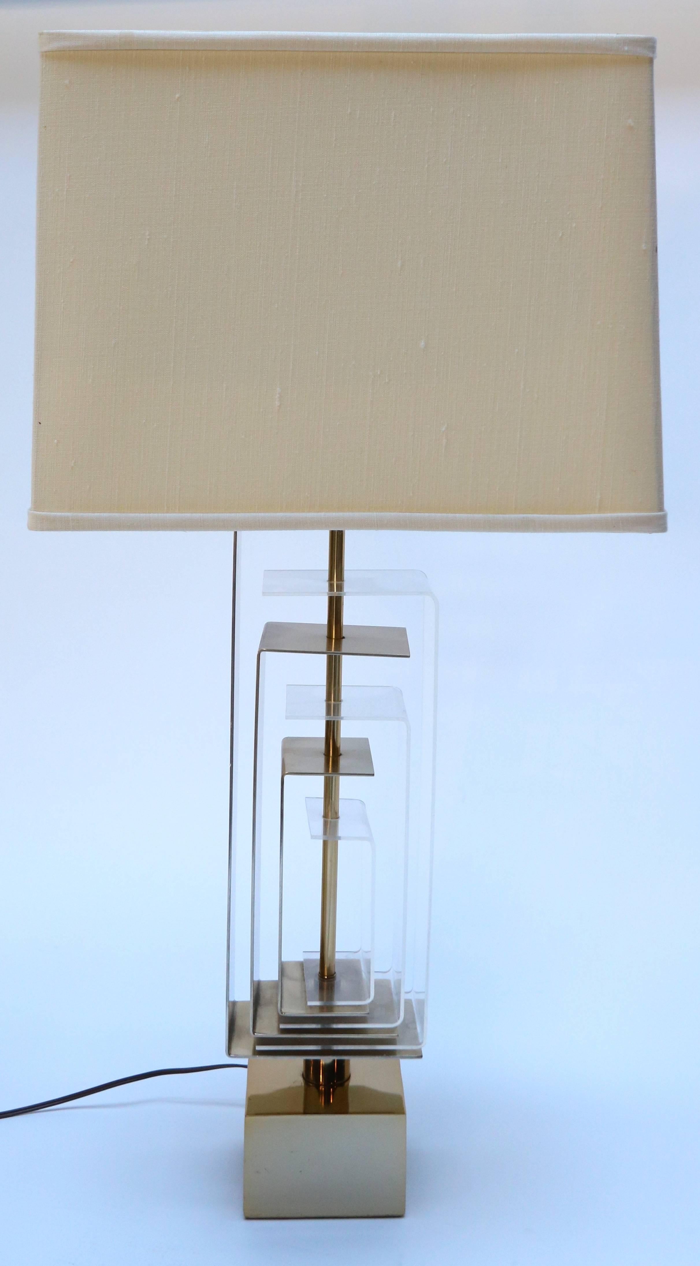 Pair of brass and acrylic table lamps by Laurel Lamp Co.

Measure: Base 5