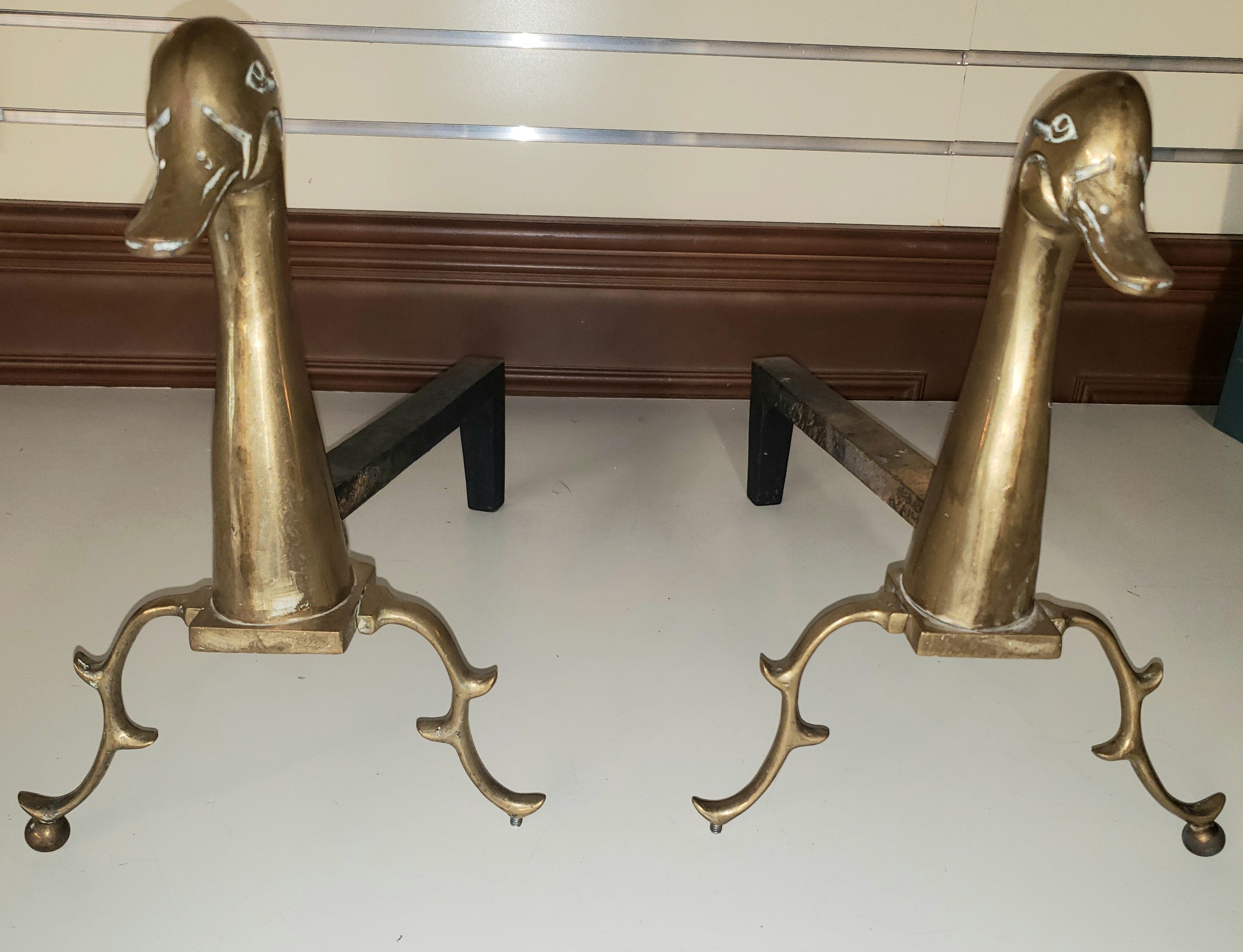 Pair of 1960s neoclassical Brass and Iron Duck Andirons. 
Measures 9