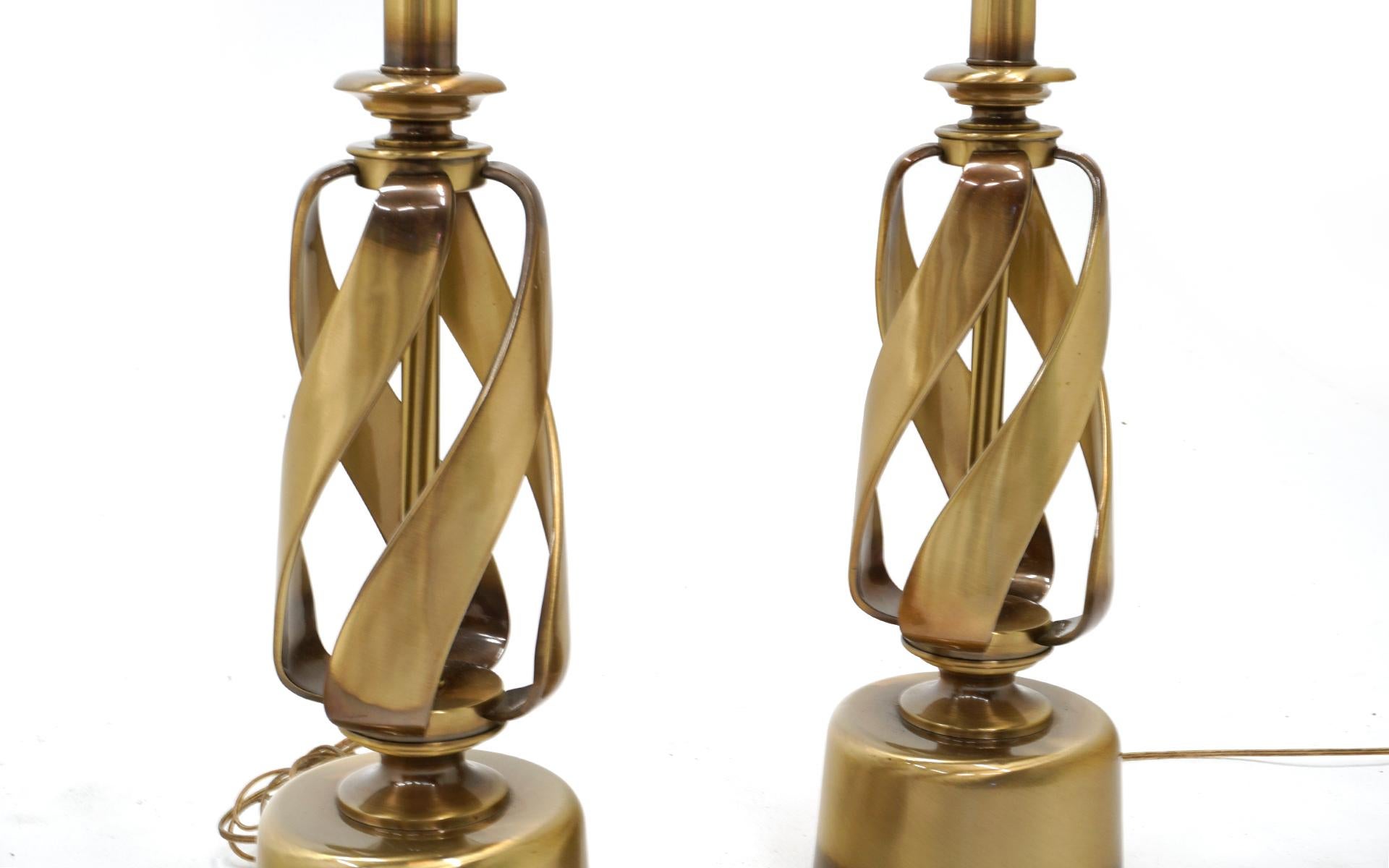 Pair of brass table lamps with the original globes. Very good to excellent condition.