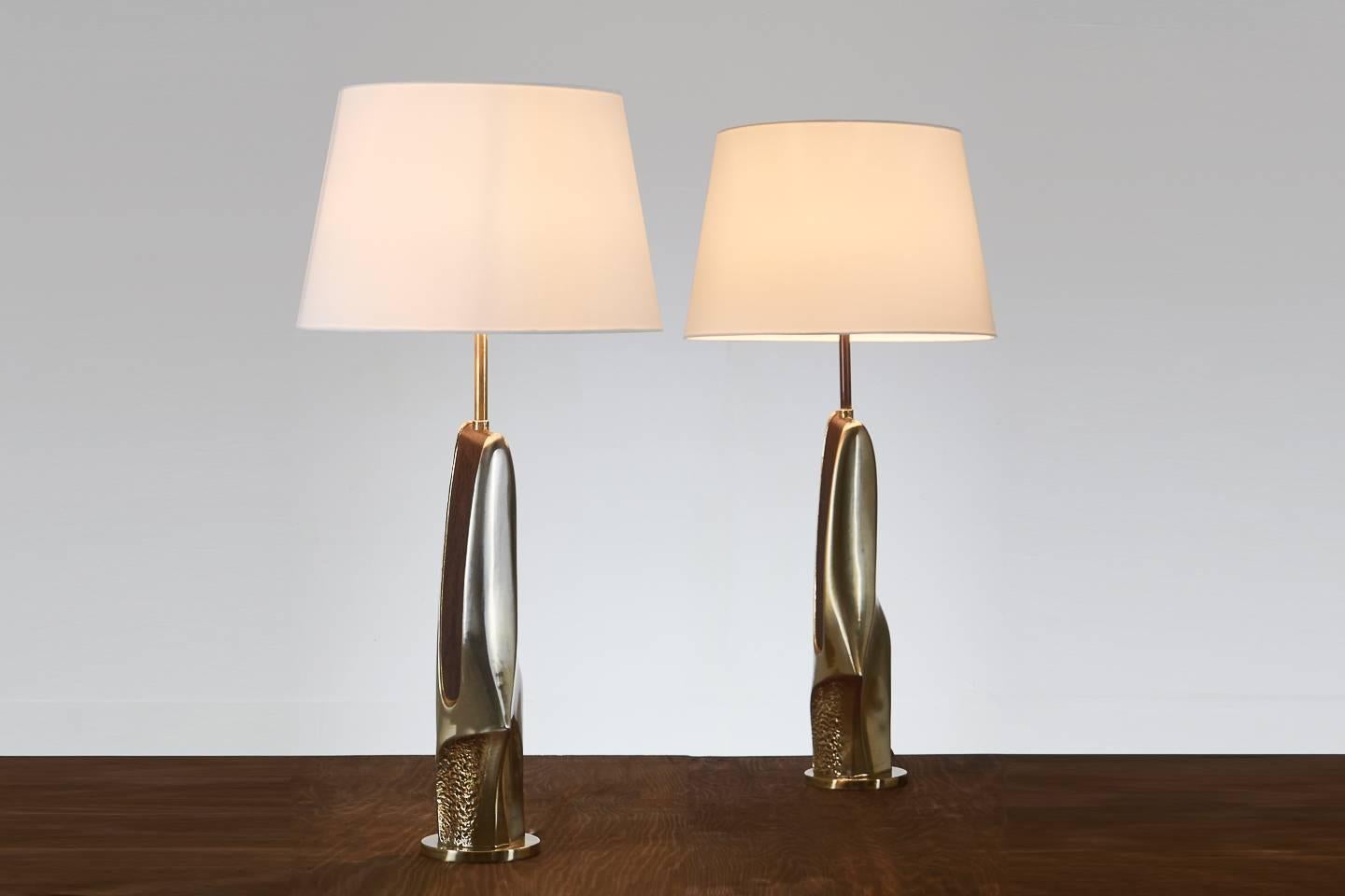 Pair of 1960s American Brutalist sculptural brass and wood table lamps.