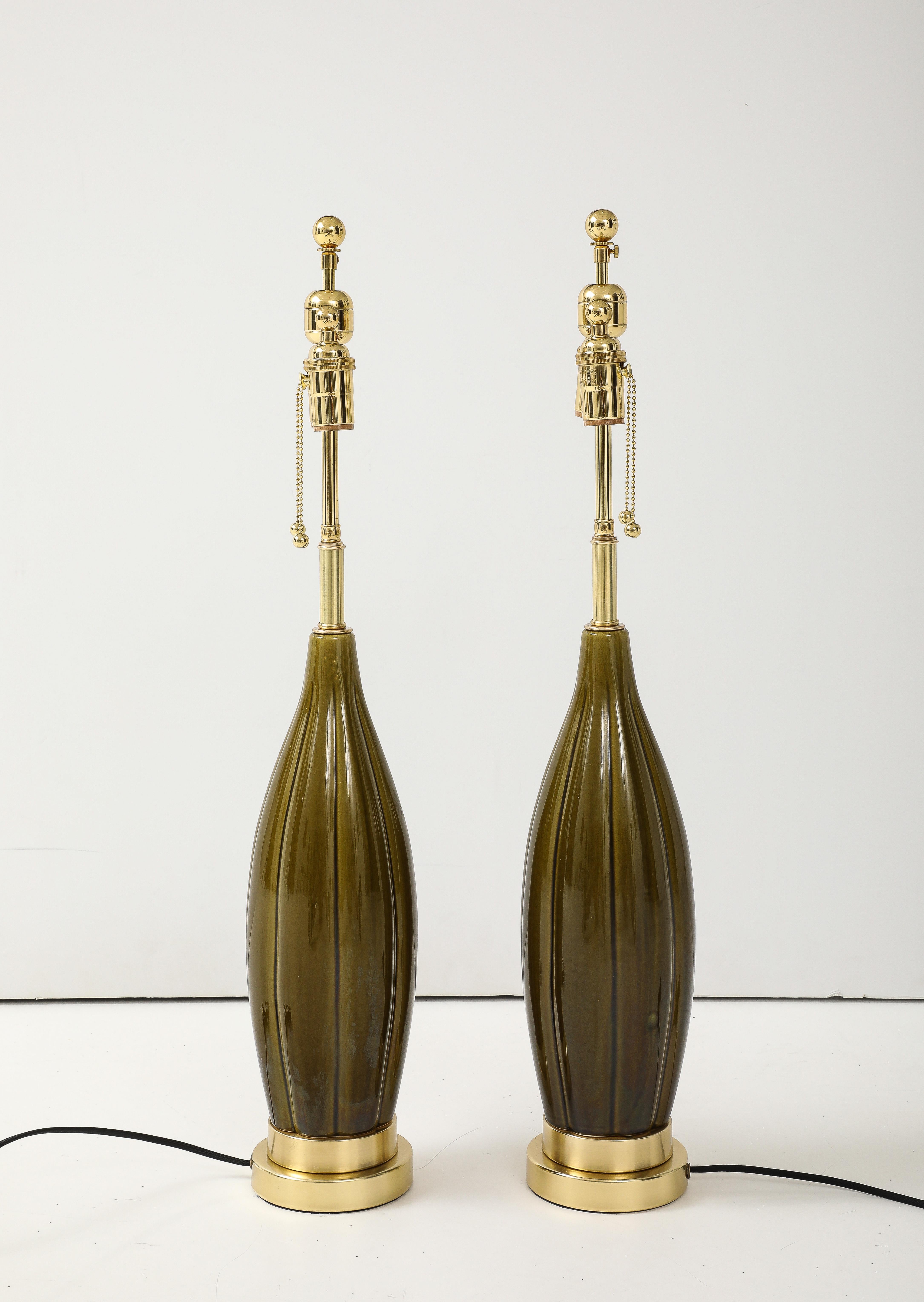 Brass Pair of 1960's Ceramic lamps with a Moss Green Glaze For Sale
