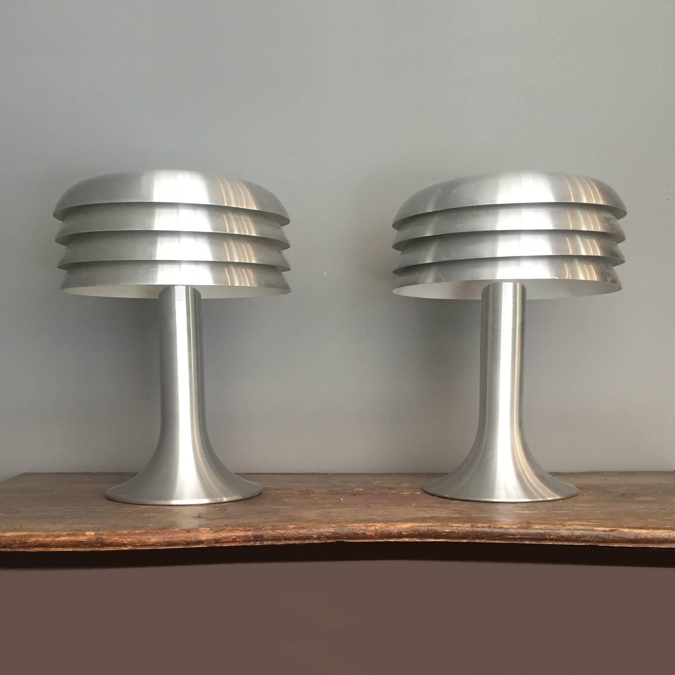 Scandinavian design class by Hans-Agne Jakobsson. Pair of gently brushed chrome lamps with four tiered integral shade. Model BN-26, produced by Hans-Agne Jakobsson AB in Markaryd, Sweden.

   