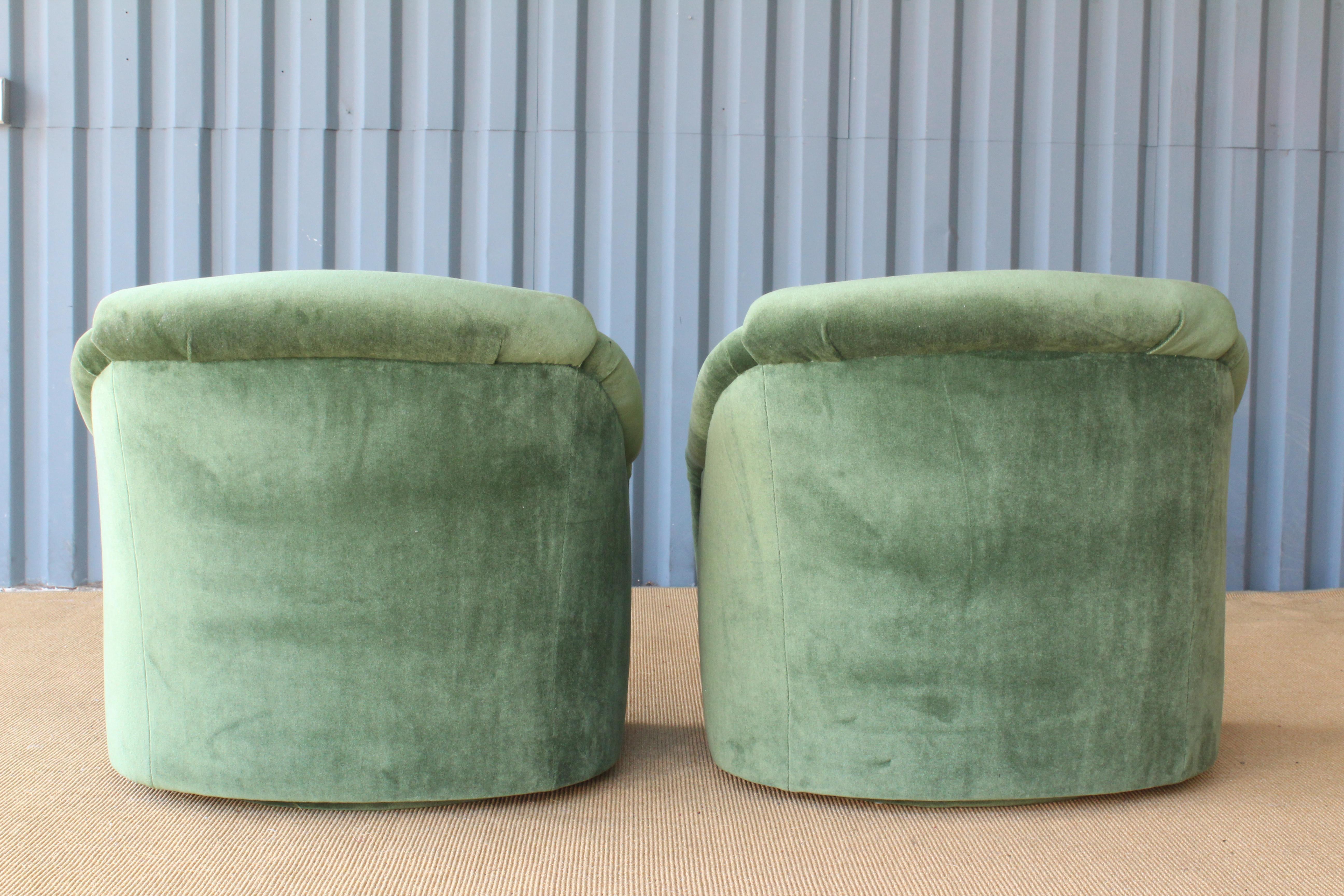 American Pair of 1960s Club Chairs on Swiveling Bases