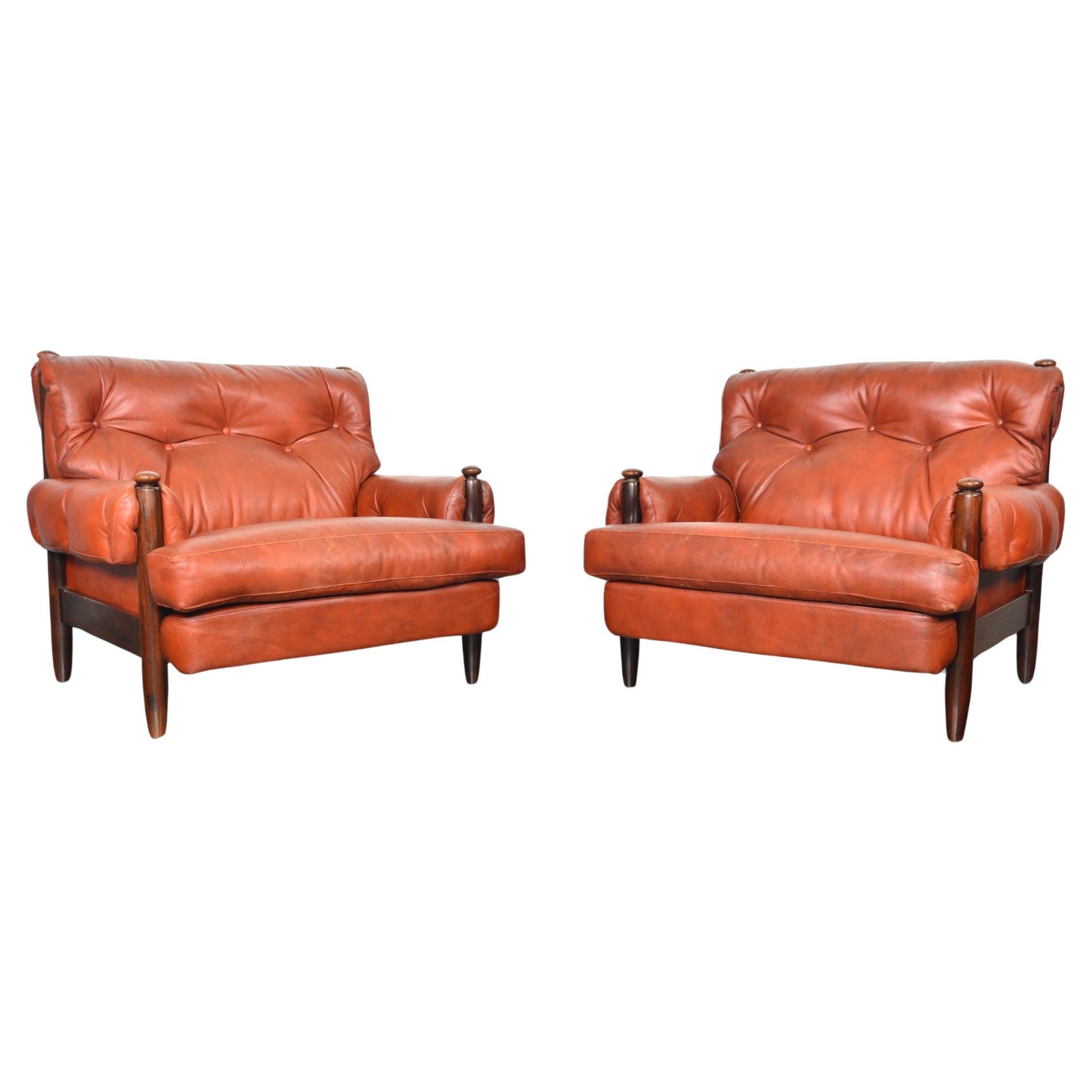 Pair of 1960s Danish Mid Century Solid Rosewood + Rust Leather Lounge Chairs