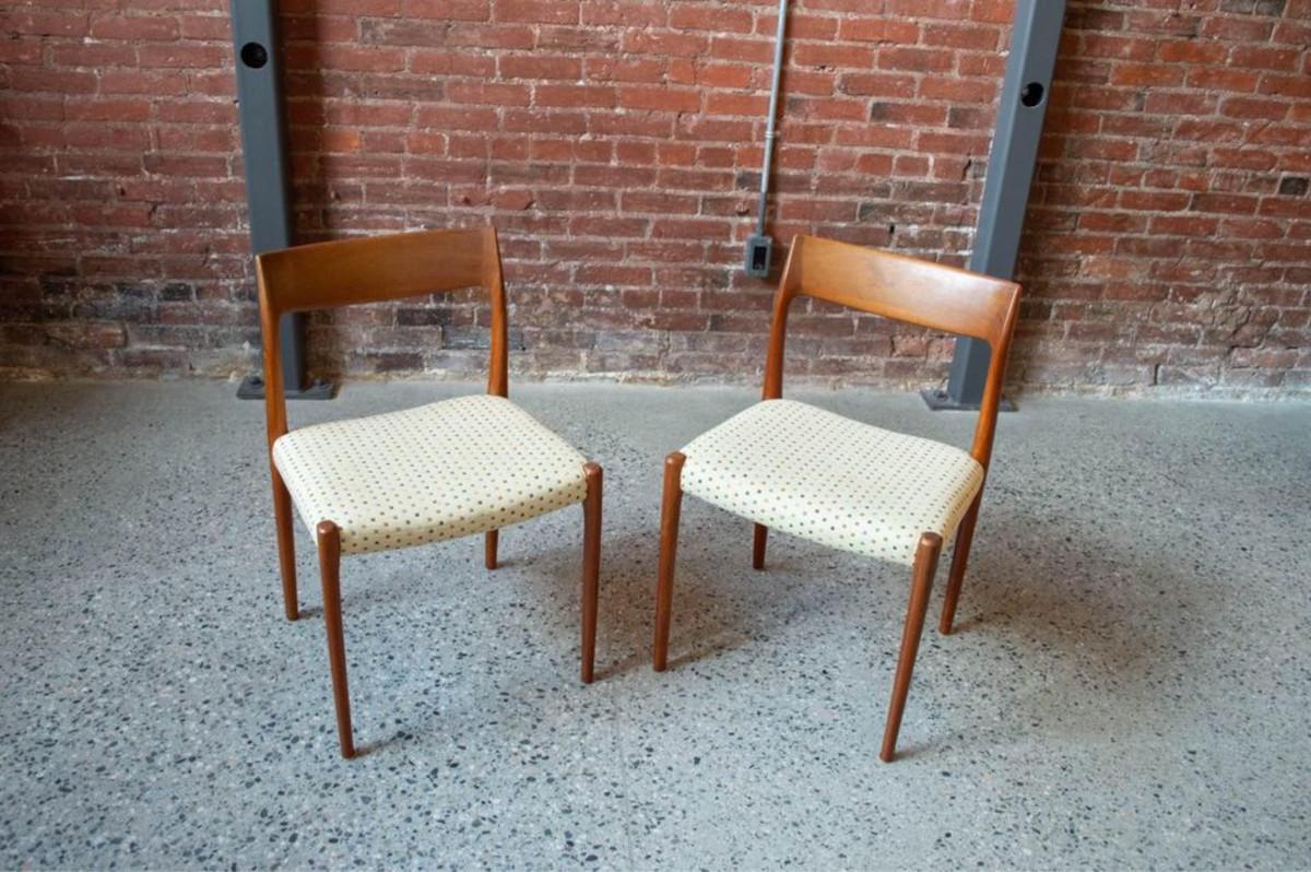 Newly arrived for this week's release, we present a lovely duo of 1960s Danish teak dining chairs, the iconic model 77 designed by Niels Møller. With elegantly crafted backrests and thoughtful curves that provide gentle comfort, these chairs exude