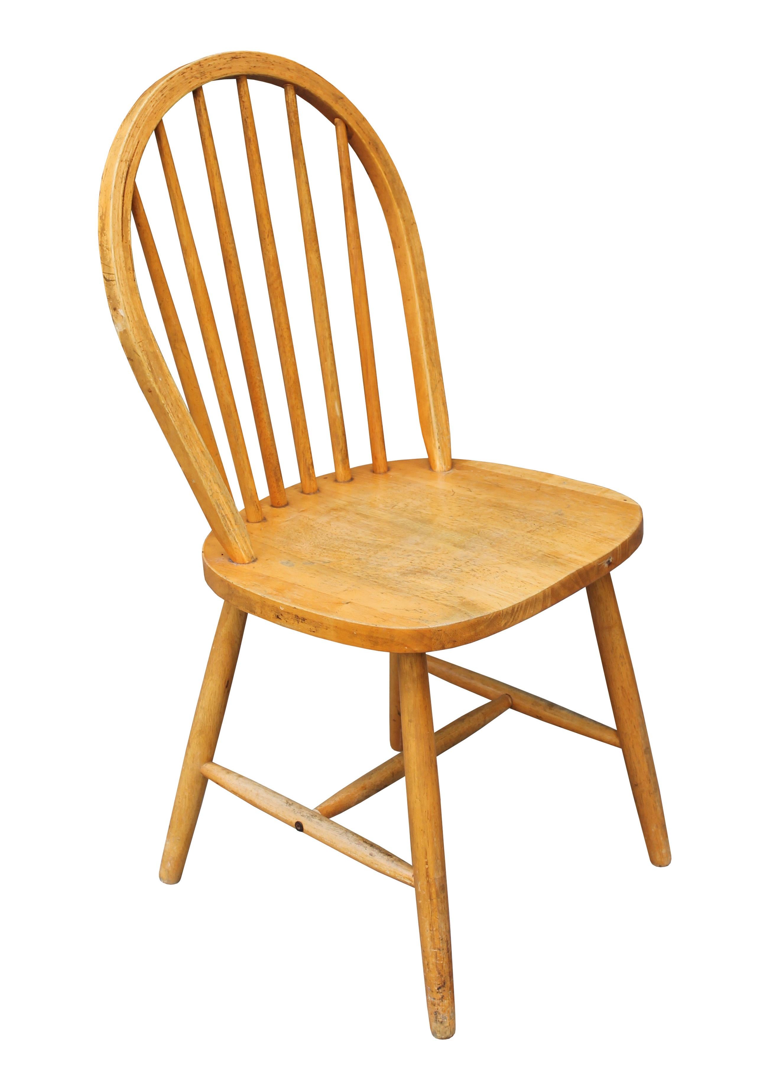 Two dining chairs designed after original Ercol Windsor Chairs Model 400. Both have the classic design with the steam bent back rail forming a clean lined profile. They also have the same tapered legs and tapered back rails and are extremely