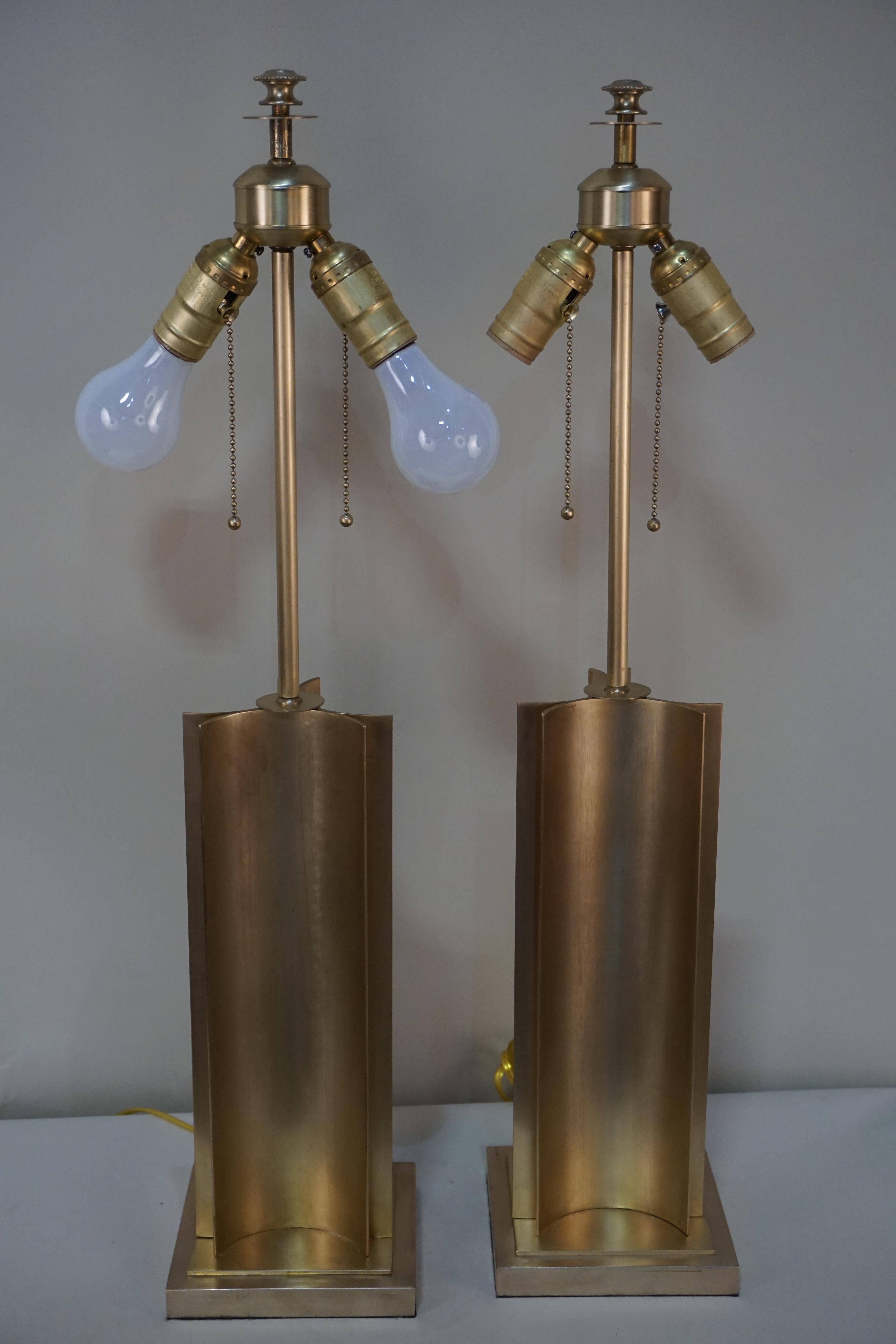 Simple but elegant pair of double light bronze table lamps.
Fitted with back-gold lining paper shades.