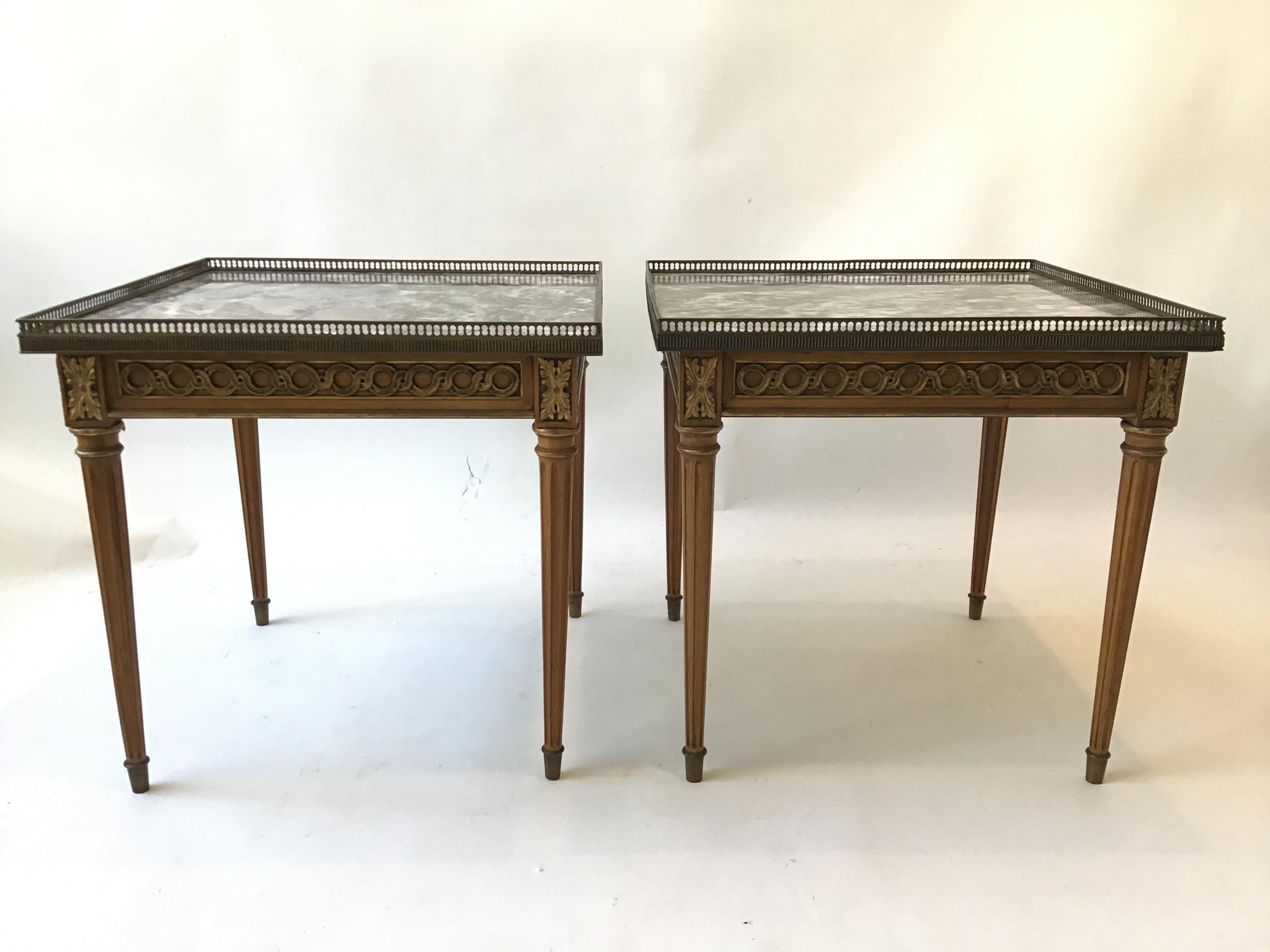 Pair of 1960s French style Louis XVI marble-top side tables. Brass gallery, wood base. Gilt accents. Tops are not attached.
These tables can be delivered in the New York tri state area.