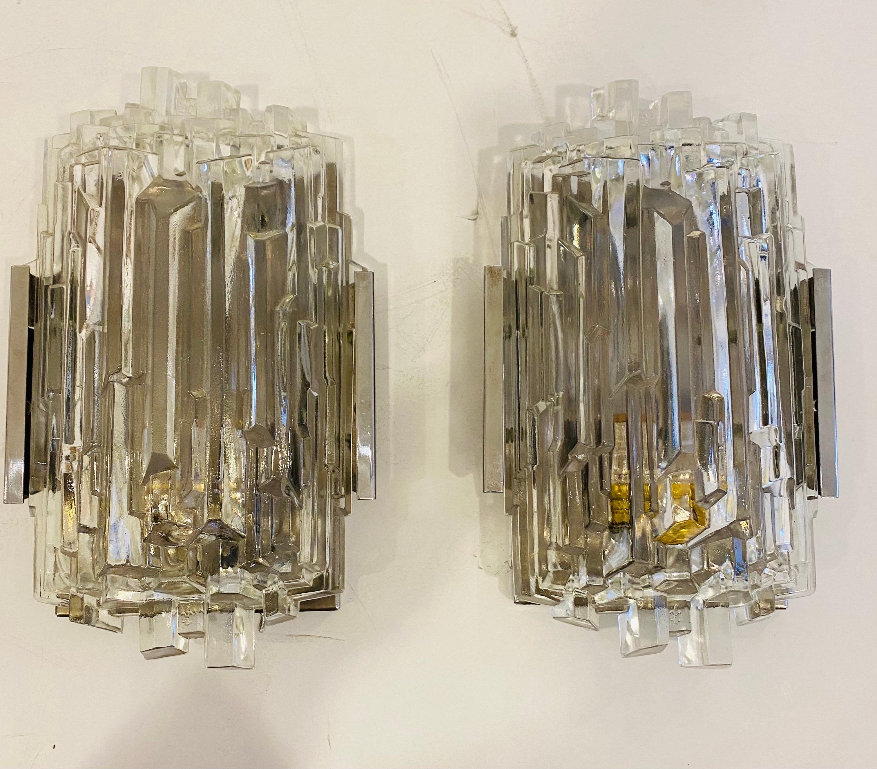 A glamorous pair of vintage 1960s German wall lights with polished chrome fixtures and faceted crystal glass shades. Newly rewired.