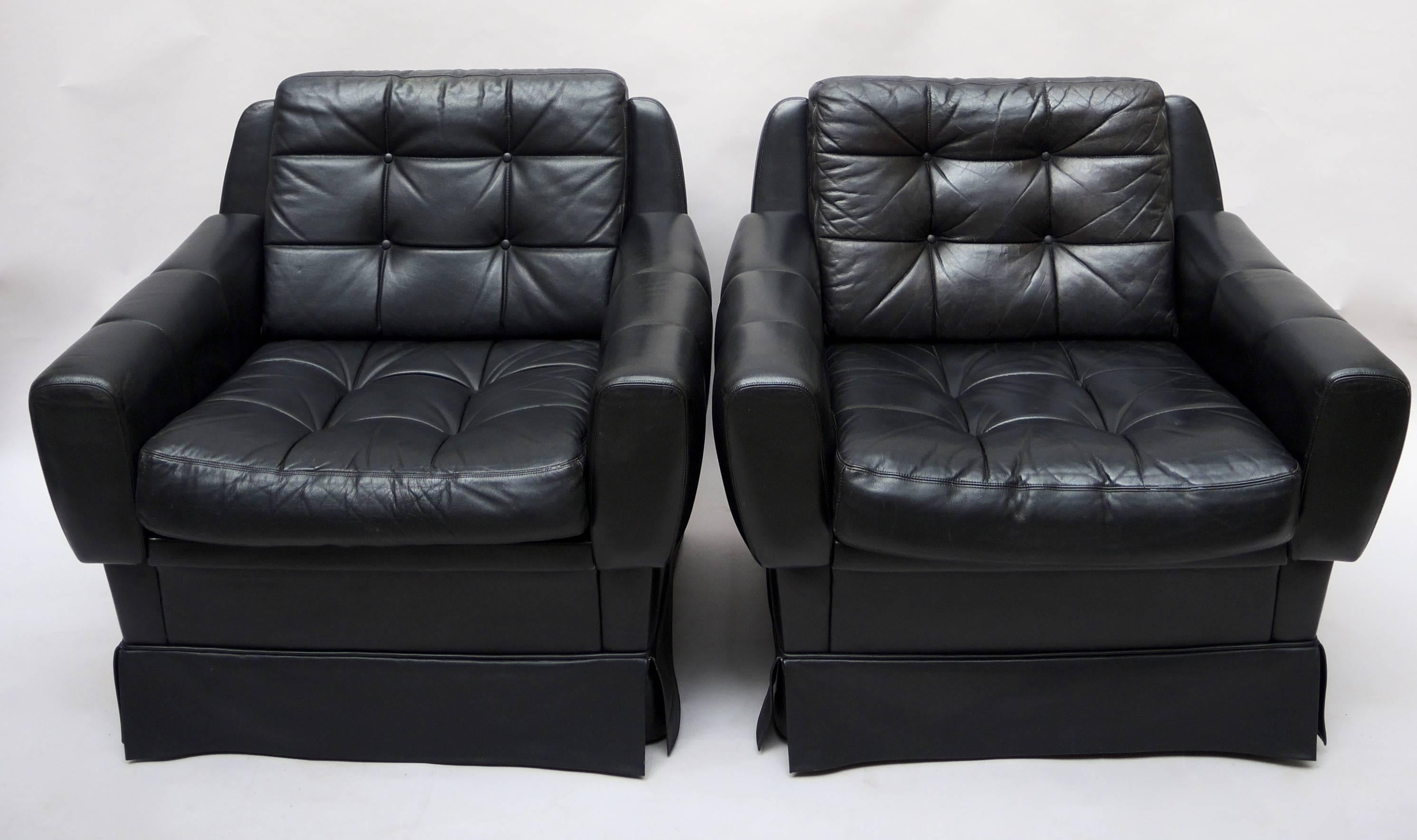 A pair of 1960s Mid-Century Modern black leather club chairs made in West Germany by Profilia. Very comfortable and in good condition.