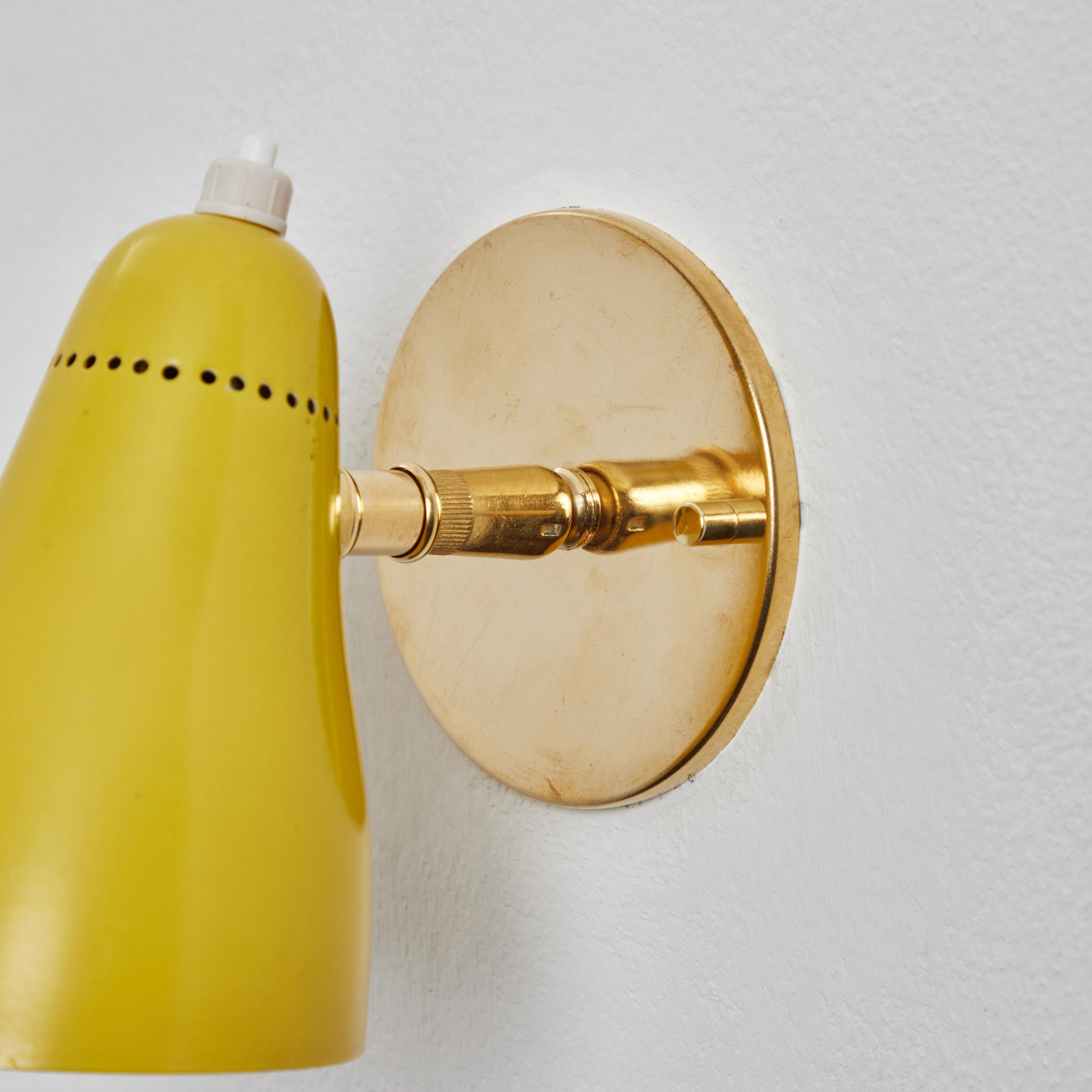 Pair of 1960s Giuseppe Ostuni Model #101 Yellow Articulating Sconces for O-Luce 1