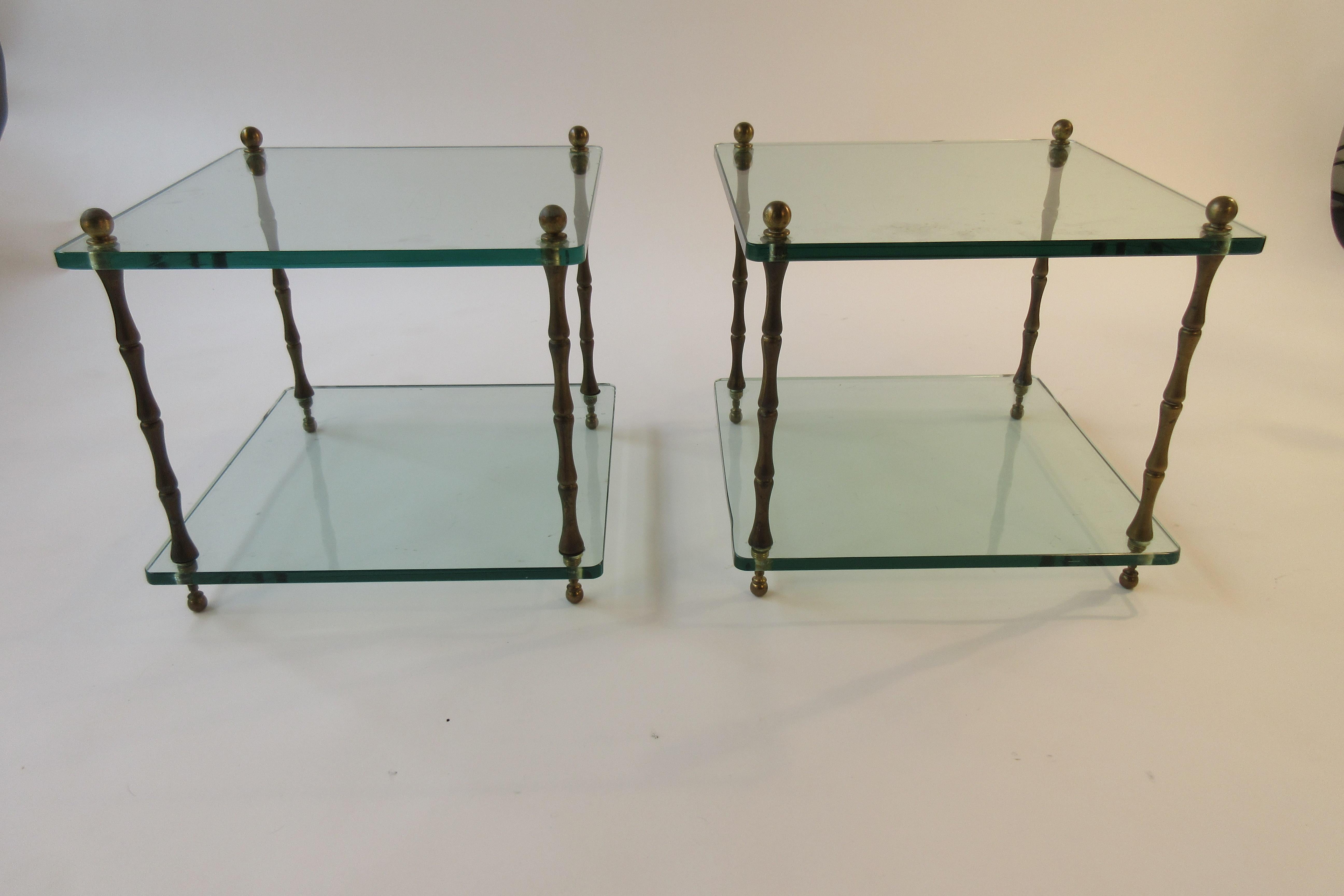 Pair of 1960s glass and brass side tables. Scratches in glass.