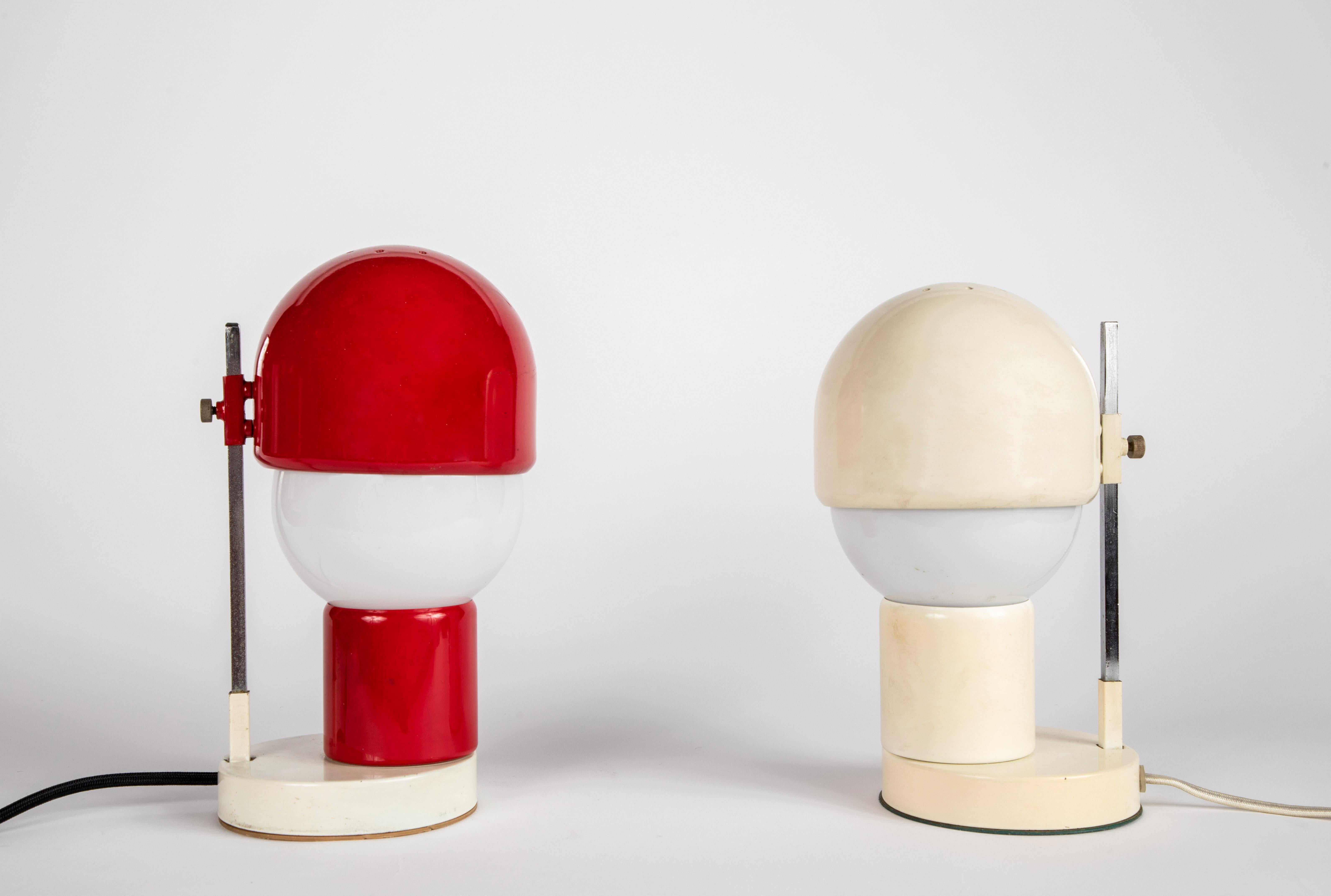Pair of 1960s glass and metal table lamps attributed to Angelo Lelli for Arredoluce. A refined design executed in red and white painted metal, nickel and blown opaline glass. An exquisite set highly indicative of the iconic later work of Lelli and