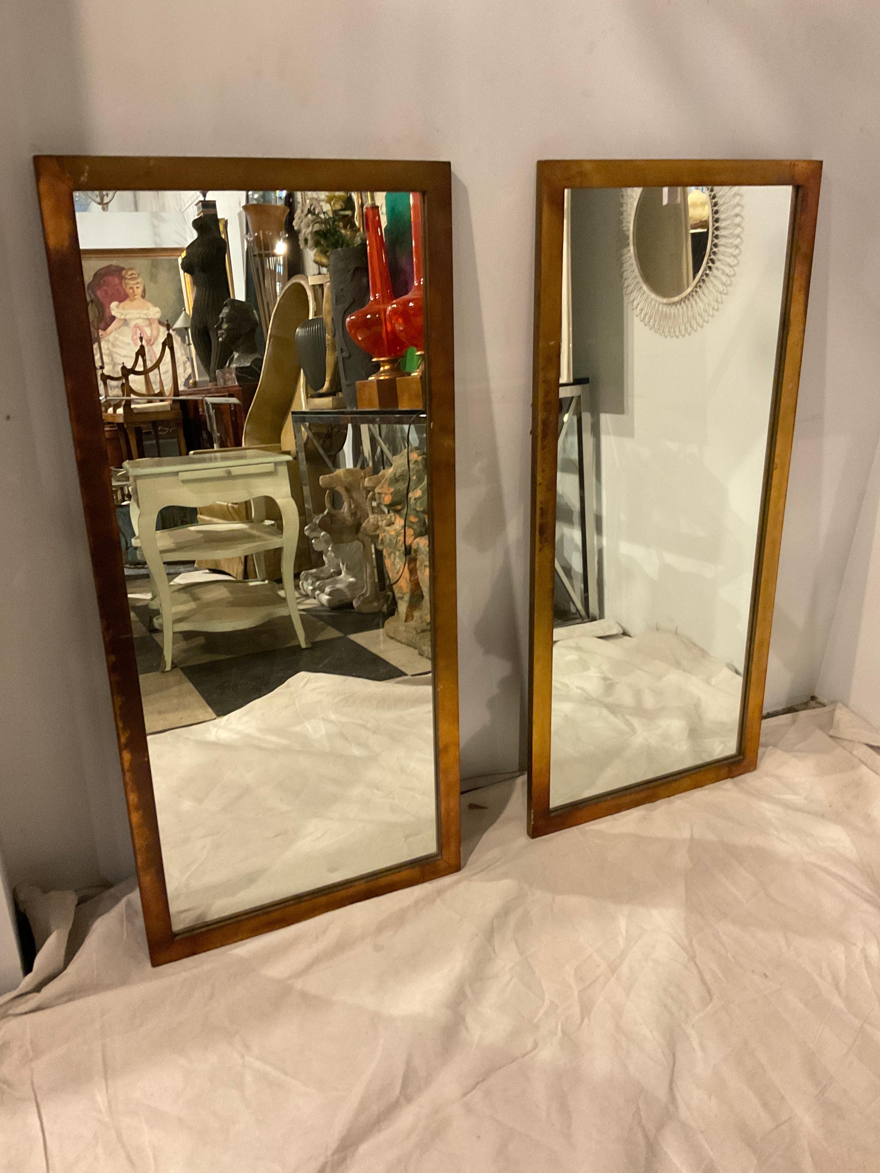 A pair of 1960s gold metallic finish , wood mirrors .
These mirrors can probably be shipped through UPS, but there would be an additional packing charge.