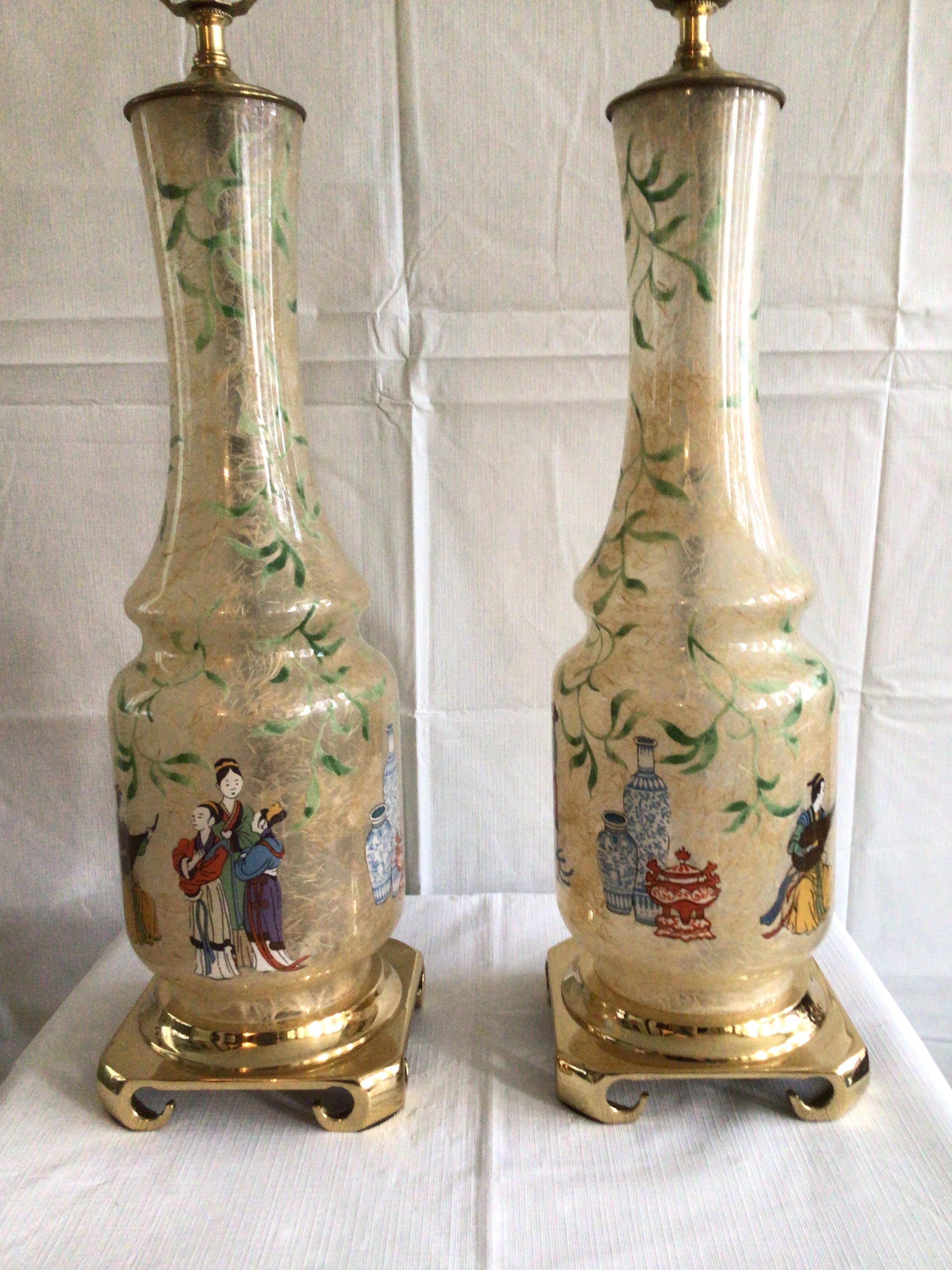 Pair of 1960s hand painted Asian glass lamps on a brass base.