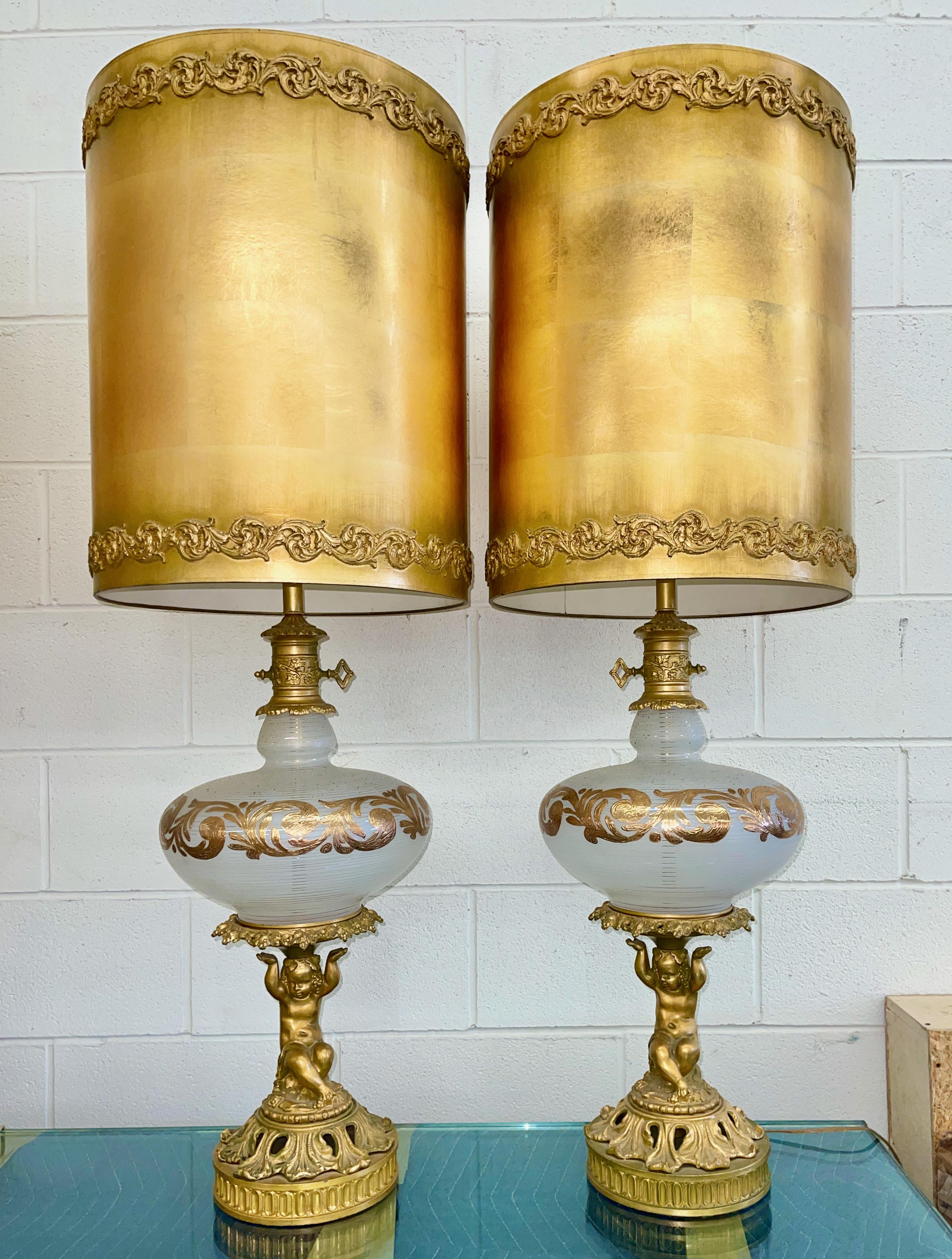 Pair of outrageously over the top (bordering on kitsch) pair of monumental table lamps created in the early 1960's in the style of Carl Falkenstein, Marbro and Rembrandt lighting. 
The ultimate in mid-century Hollywood Regency including original
