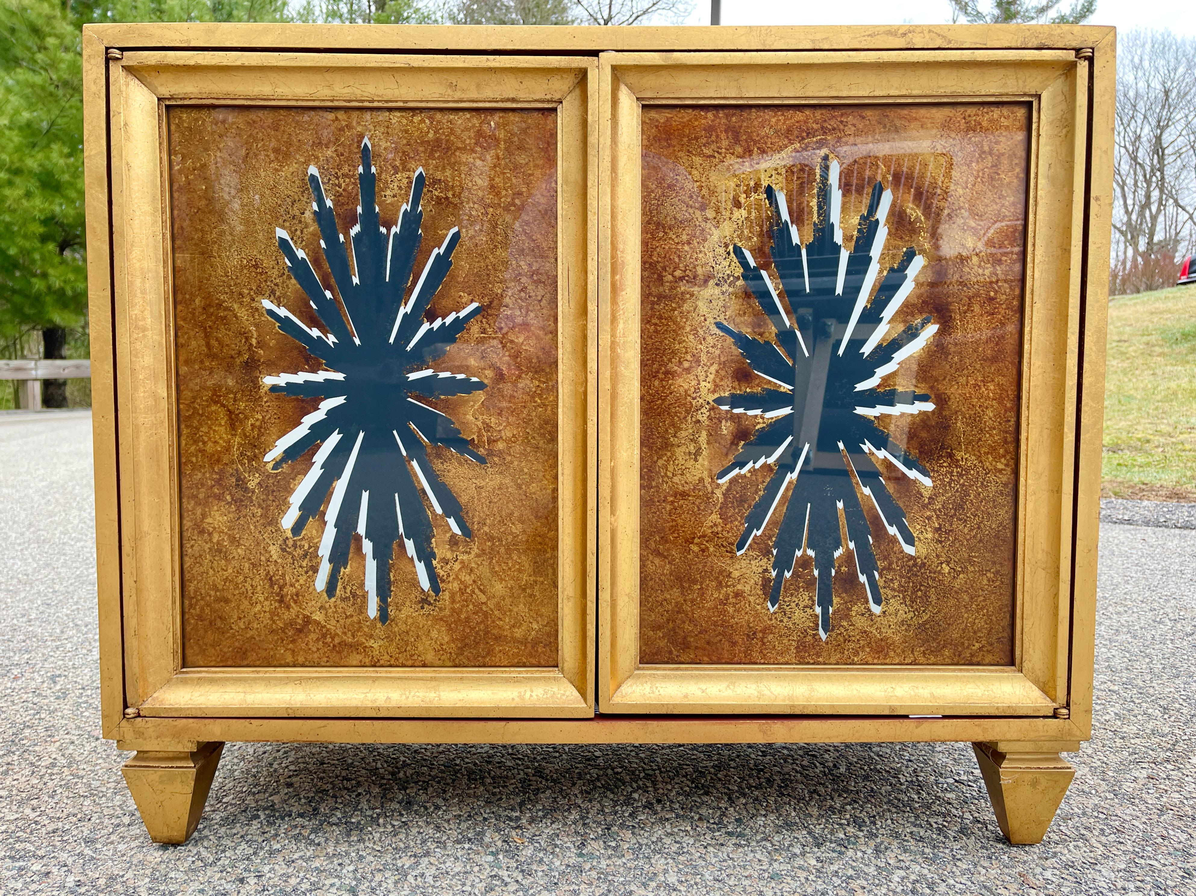 Amazing and rare pair of vintage early 1960's cabinets from from an outrageously over-the-top period Hollywood Regency decorated home outside of Boston; think Zsa Zsa on steroids.
Each cabinet is covered in gold leaf, has double doors with Tony