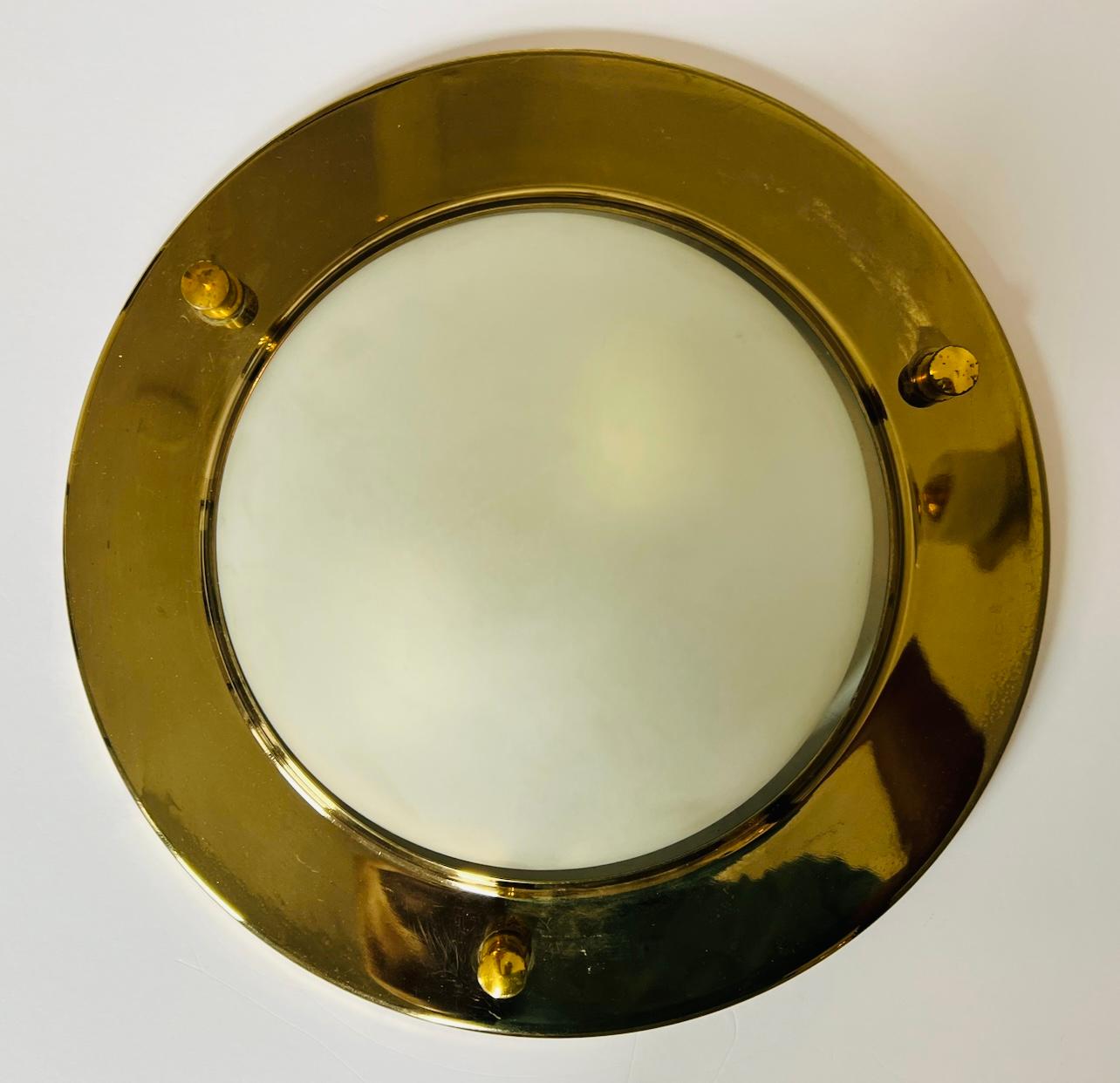 A pair of polished golden nautical style flush ceiling lights with frosted white glass dome shades. Newly rewired. 2 standard e26 lights sockets each.