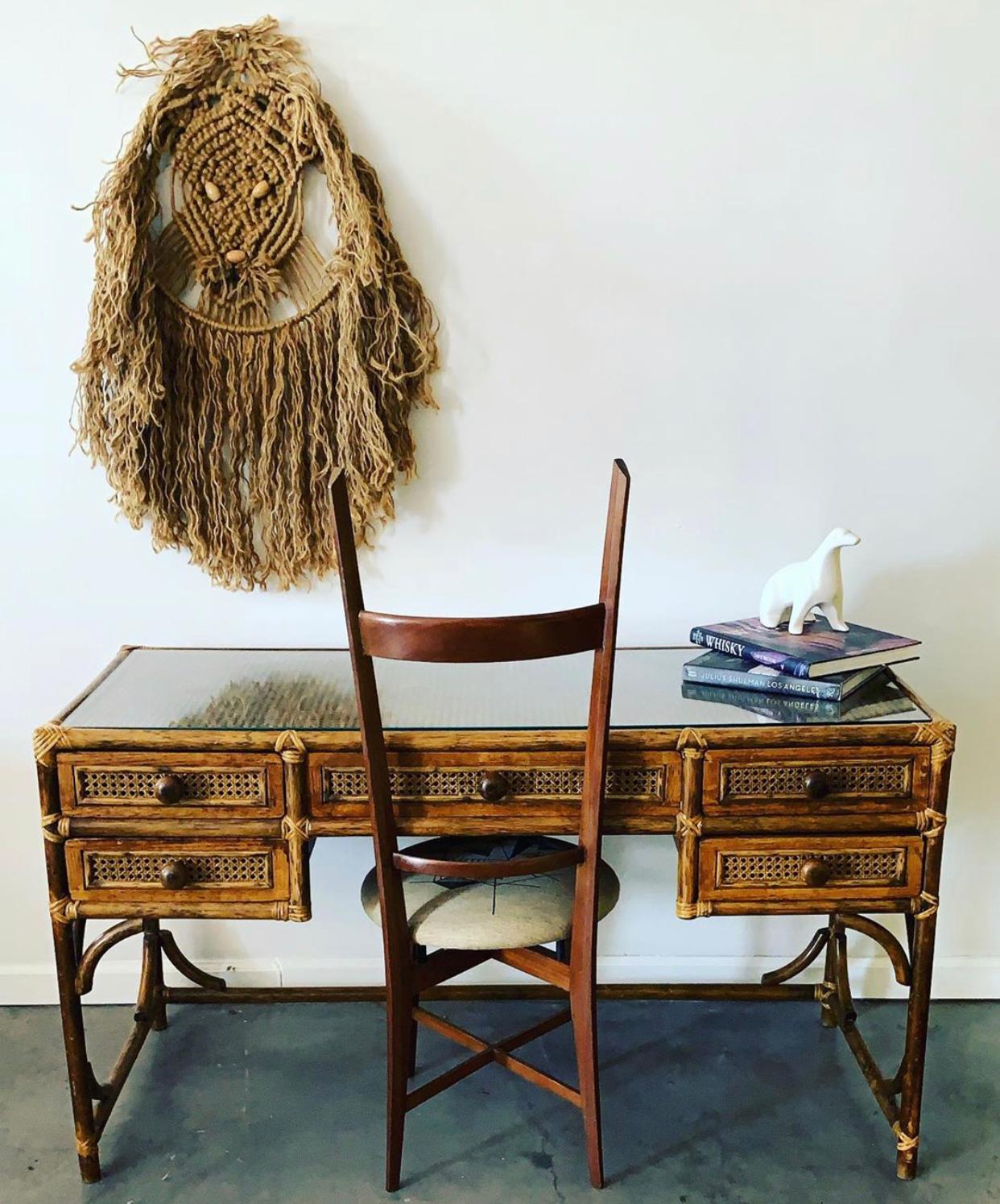 An absolutely stunning pair of walnut Italian modern accent chairs in the style of Gio Ponti or Paolo Buffa. These ladderback chairs feature an almost sabre back shape. These sculptural chairs feature a vintage geometric fabric.

These chairs are