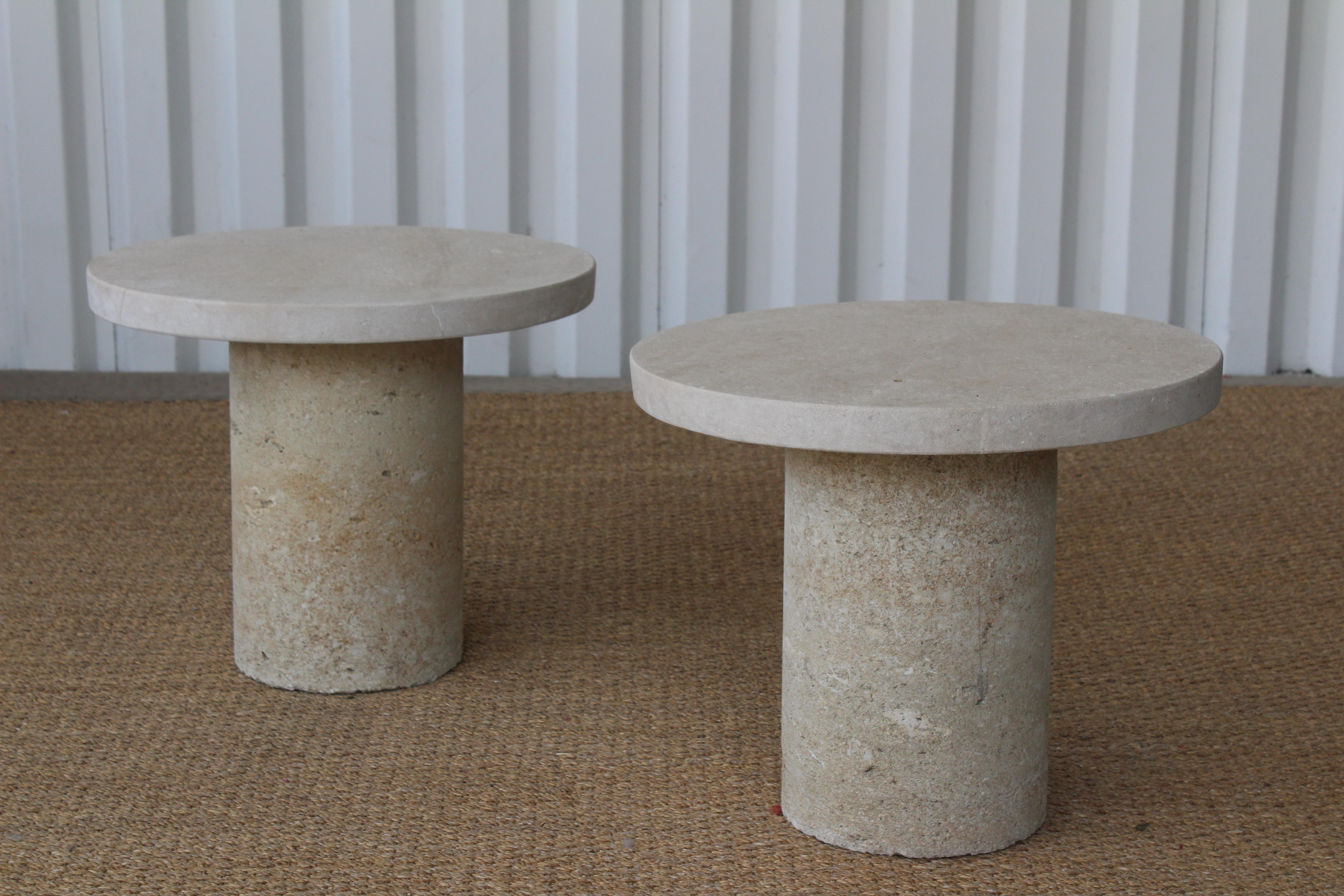 Pair of 1960s Italian travertine solid stone side tables. Suitable for indoor or outdoor use. Pair available, each sold individually. The tops sit on the bases freely and can be removed for easier transportation. In over all good condition with most
