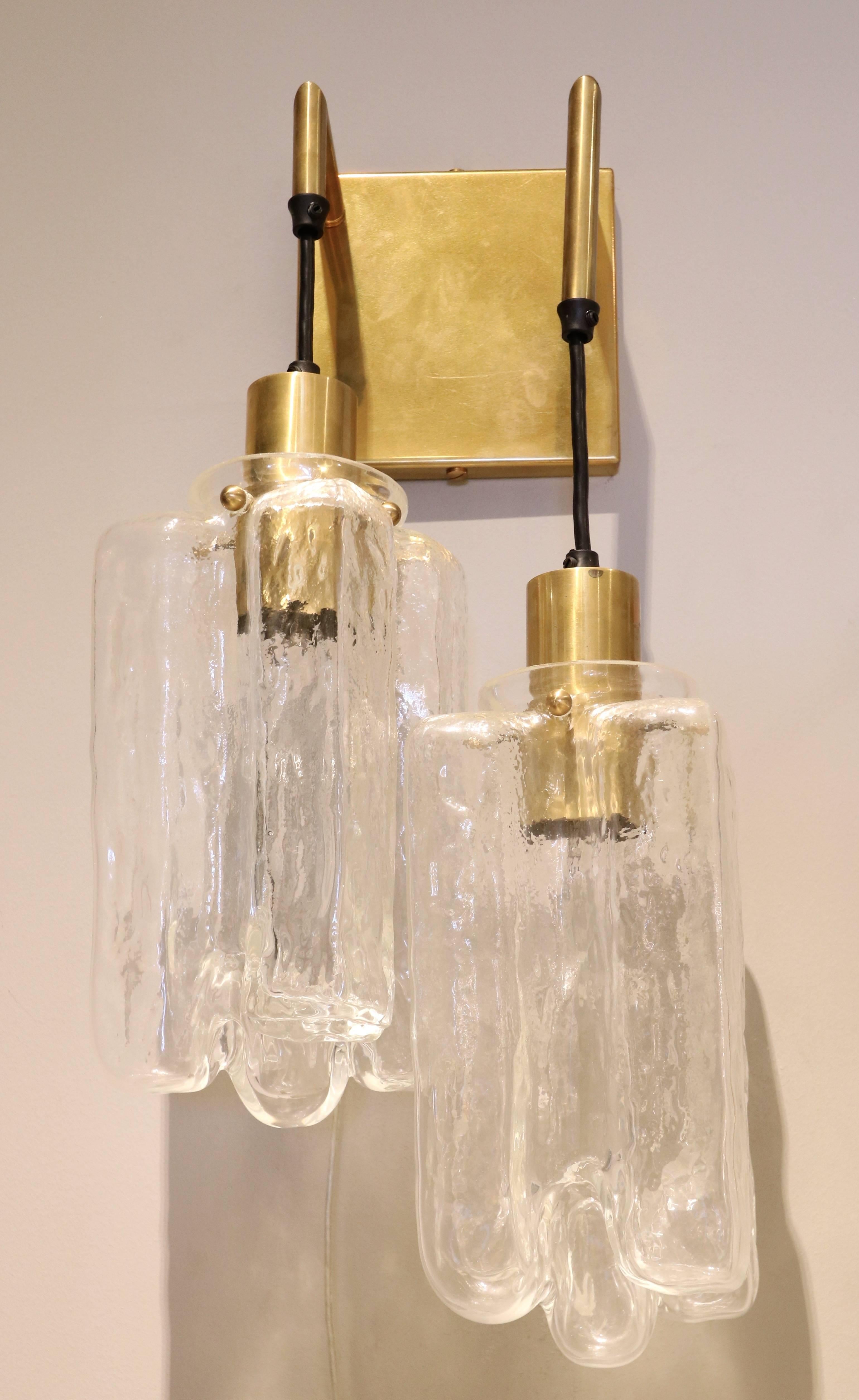 Pair of Kalmar glass sconces from the 1960s with brass wall plate and sockets.
    