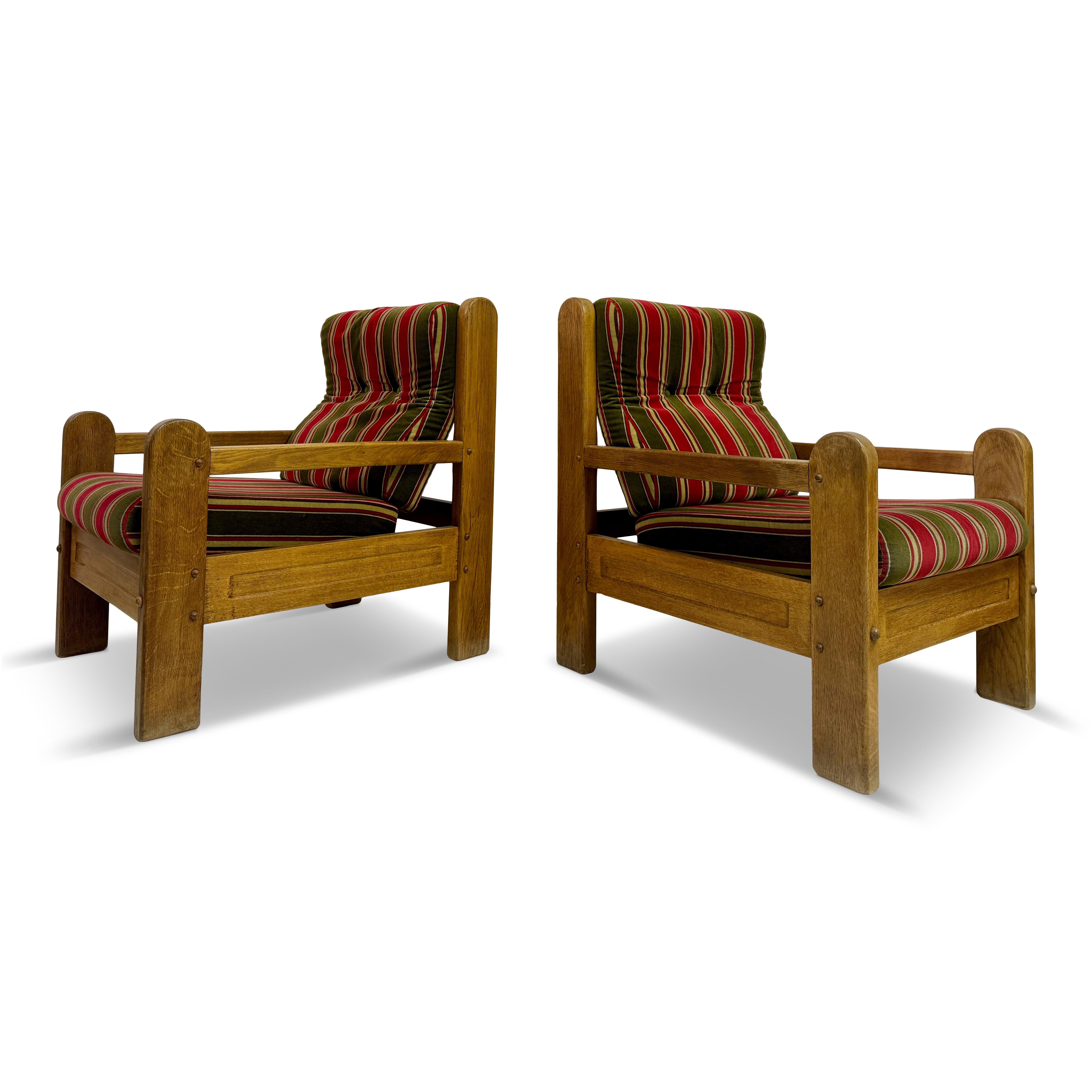 Pair of armchairs

Oak

Chunky shape

Slatted back

Original upholstery can be changed if required

Seat height 45cm

1960s/1970s