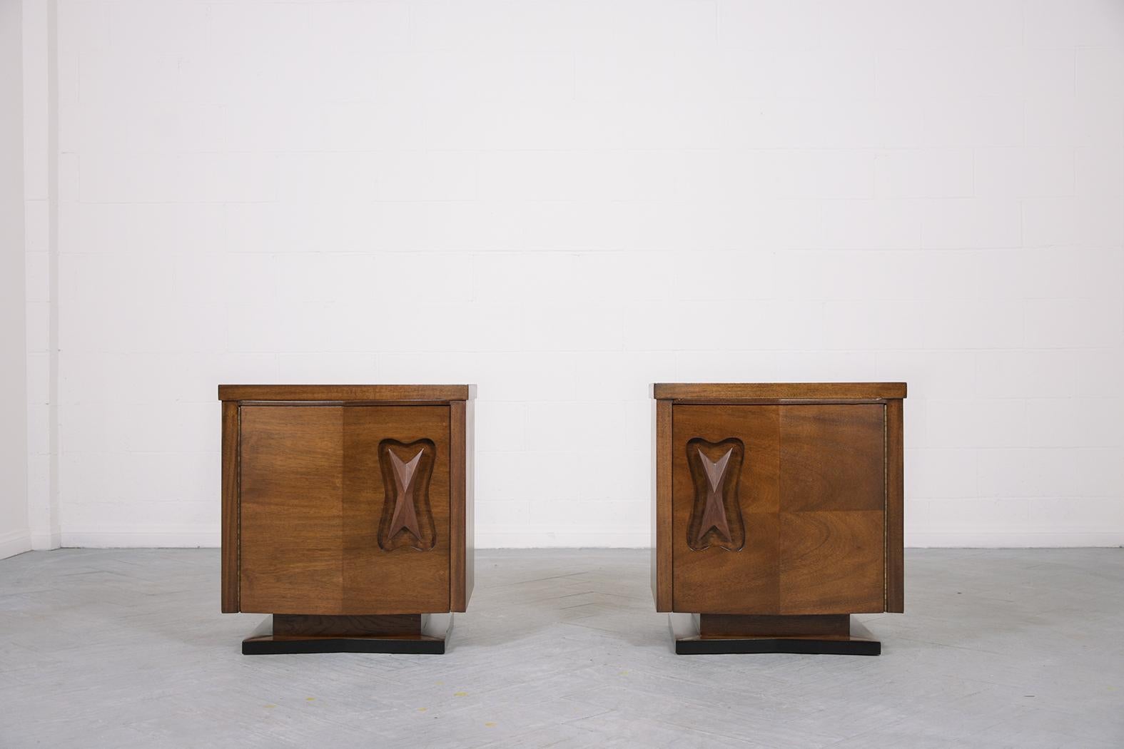 This extraordinary pair of mid-century walnut nightstands are in great condition hand-crafted out of walnut and have been completely restored and refinished by our professional expert craftsmen team. These 1960s bedside tables are eye-catching and