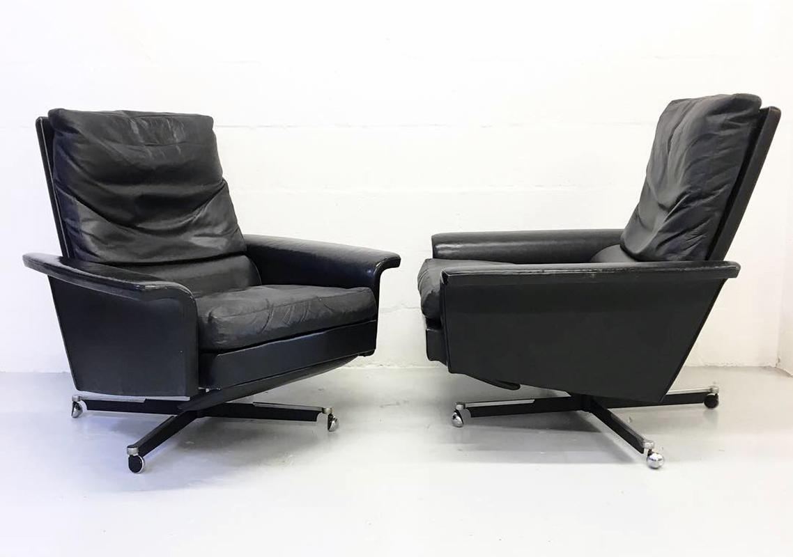 Superb pair of 1960s European modern black leather reclining 'Lay-z-boy' lounge chairs. Designer and manufacturer unknown but these are the third pair I have owned in the last 15 years all of which were sourced in Germany.
Terrific patinated