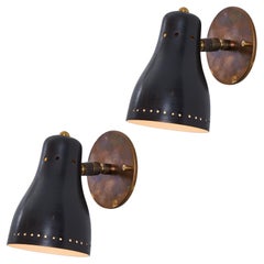 Pair of 1960s Perforated Black Wall Lamps Attributed to Jacques Biny