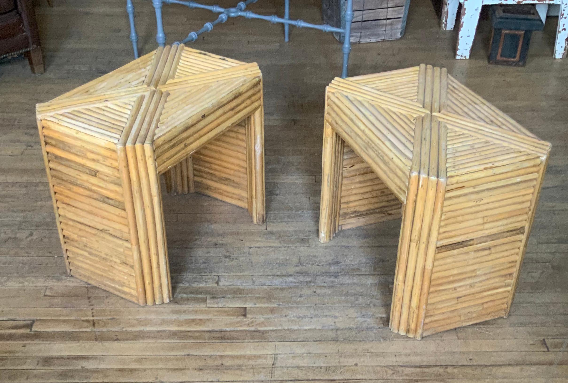 A pair of vintage 1960's tables in reeded rattan, with a chevron pattern on the top, and open sides. Great design, in vintage condition with age expected wear overall.