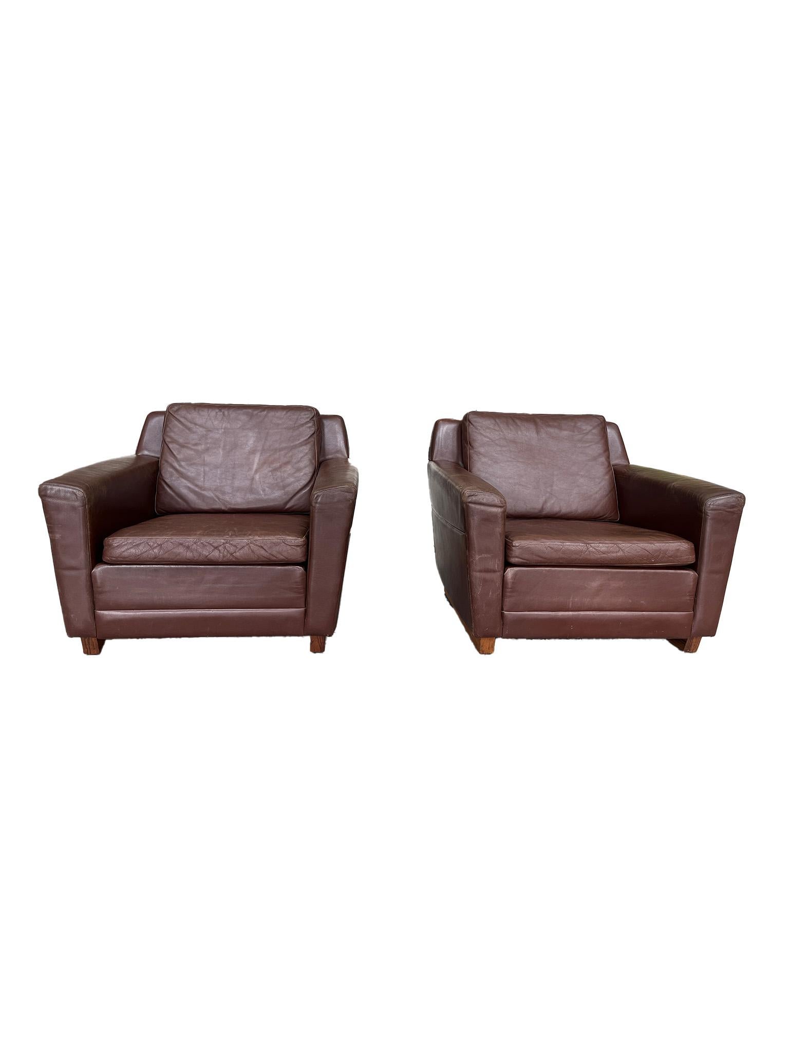 Gorgeous and comfortable, this rare pair of lounge chairs were designed by Georg Thams in the mid 1960s and manufactured most likely by møbelfabrik in Denmark. They were crafted with a sturdy rosewood frame with runner-style legs, a low seat, and