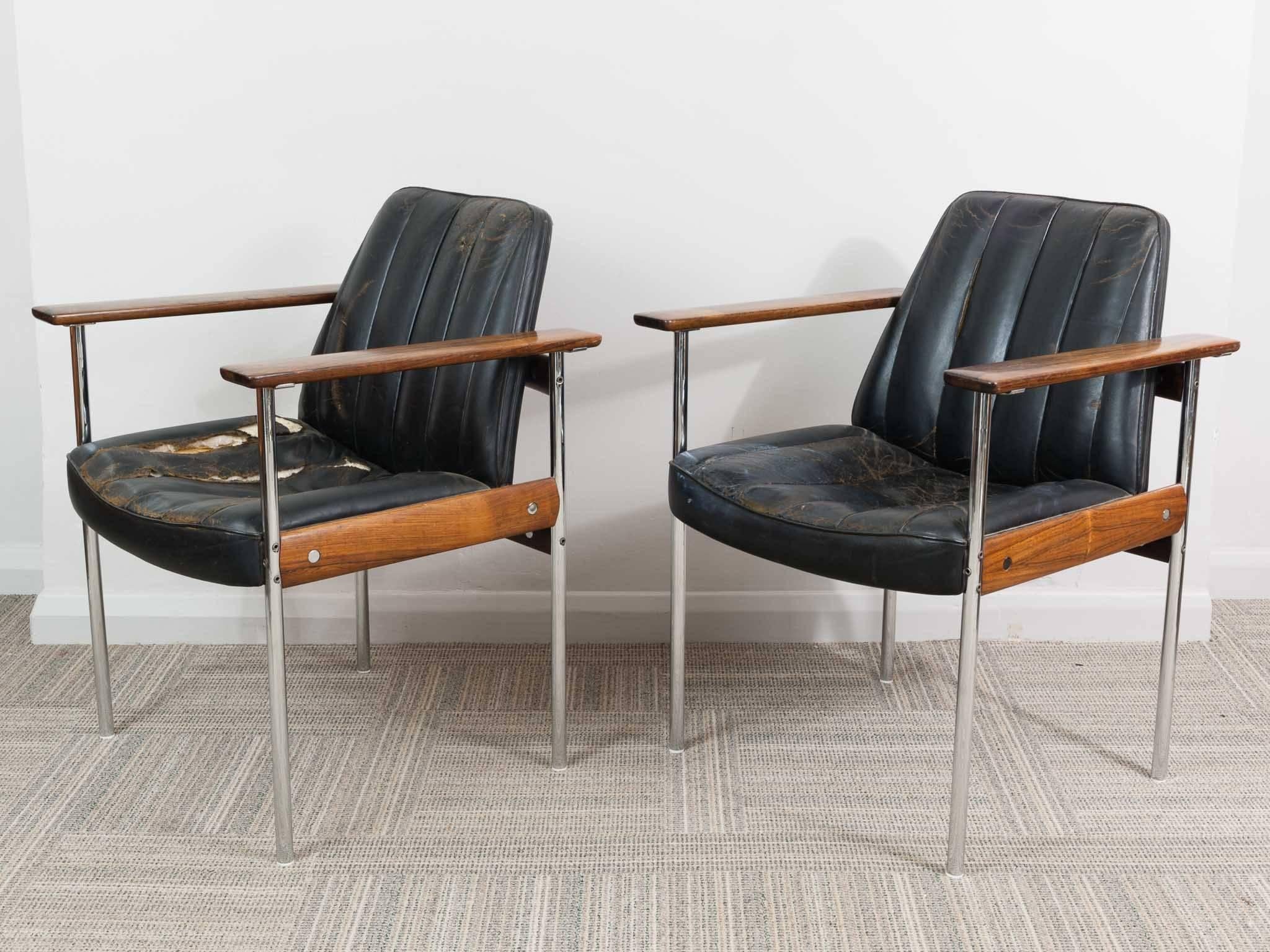 A pair of low-backrest armchairs designed by Sven Ivar Dyste and produced by Dokka Møbler, Norway. The chrome elements to the frame have been re-chromed and are in excellent condition. The Rosewood shows some signs of age but is also in very good