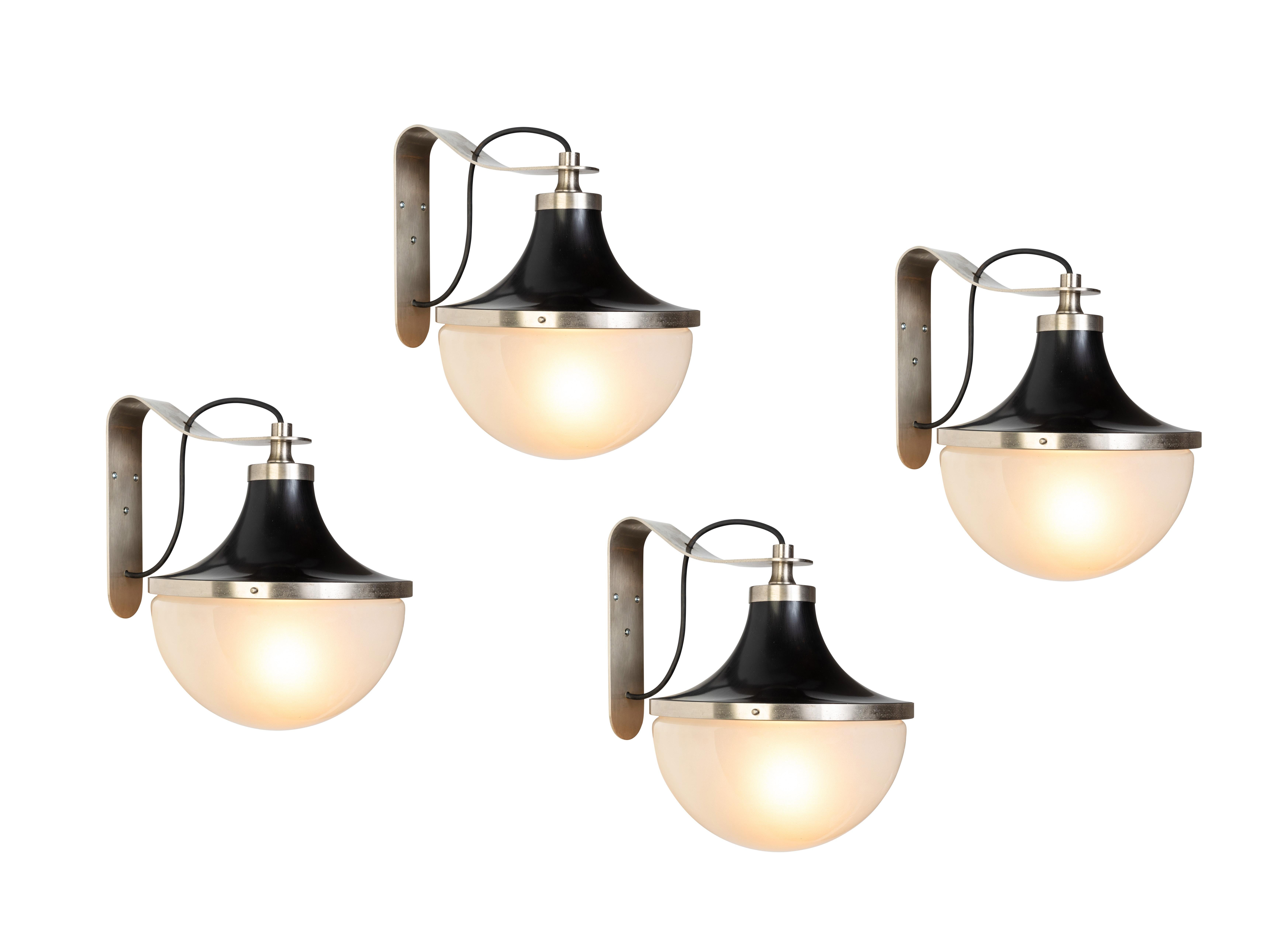 1960s Sergio Mazza 'Pi' wall lights for Artemide. Executed in nickeled brass, black painted metal and opaline glass. Architectural and incomparable, these sconces emit a pleasingly filtered light through its beautiful glass shade. 

Price is per