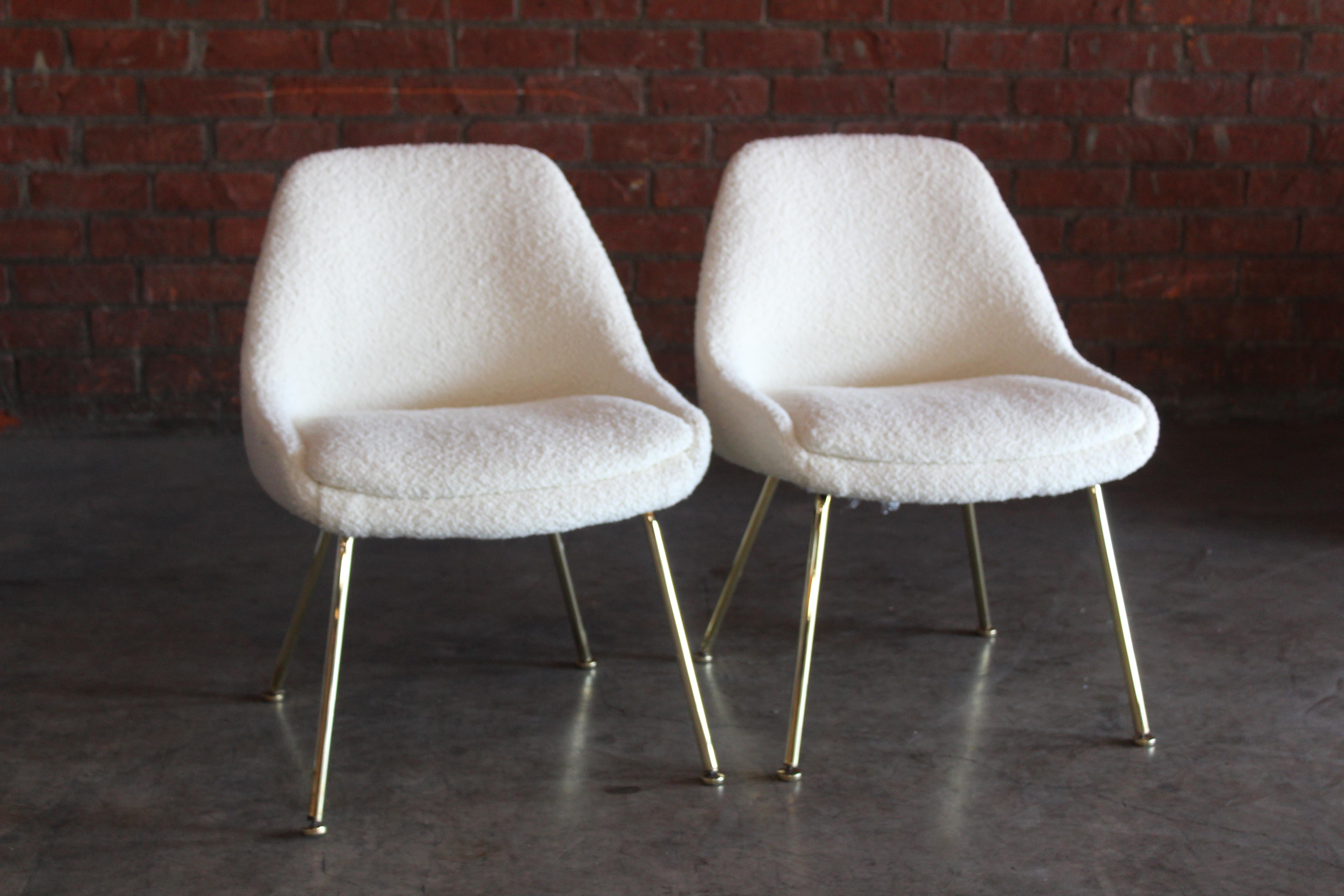 Pair of 1960s armless side chairs, newly upholstered in an Italian wool blend bouclé. The bases have been recently brass plated. In overall excellent condition. Sold as a pair. 
 