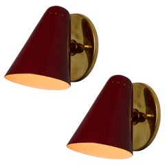 Pair of 1960s Stilnovo Perforated Red Metal and Brass Articulating Sconces