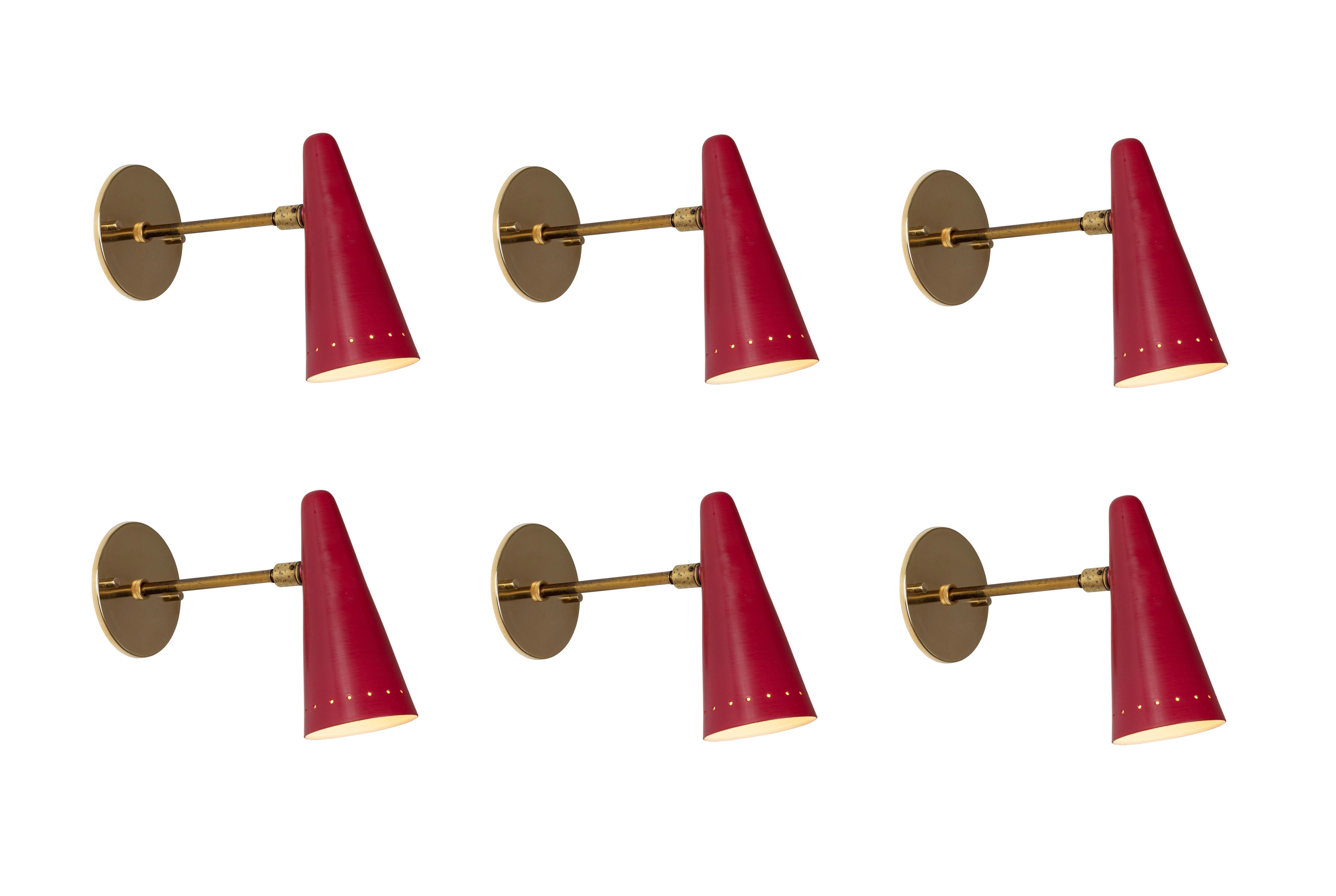 Pair of 1960s Stilux articulating red cone sconces. In the manner of Gino Sarfatti. Executed in brass and red painted aluminum. Sconces pivot up/down and left/right. Wired for US electrical. Custom patinated brass backplates.

Price is per pair.