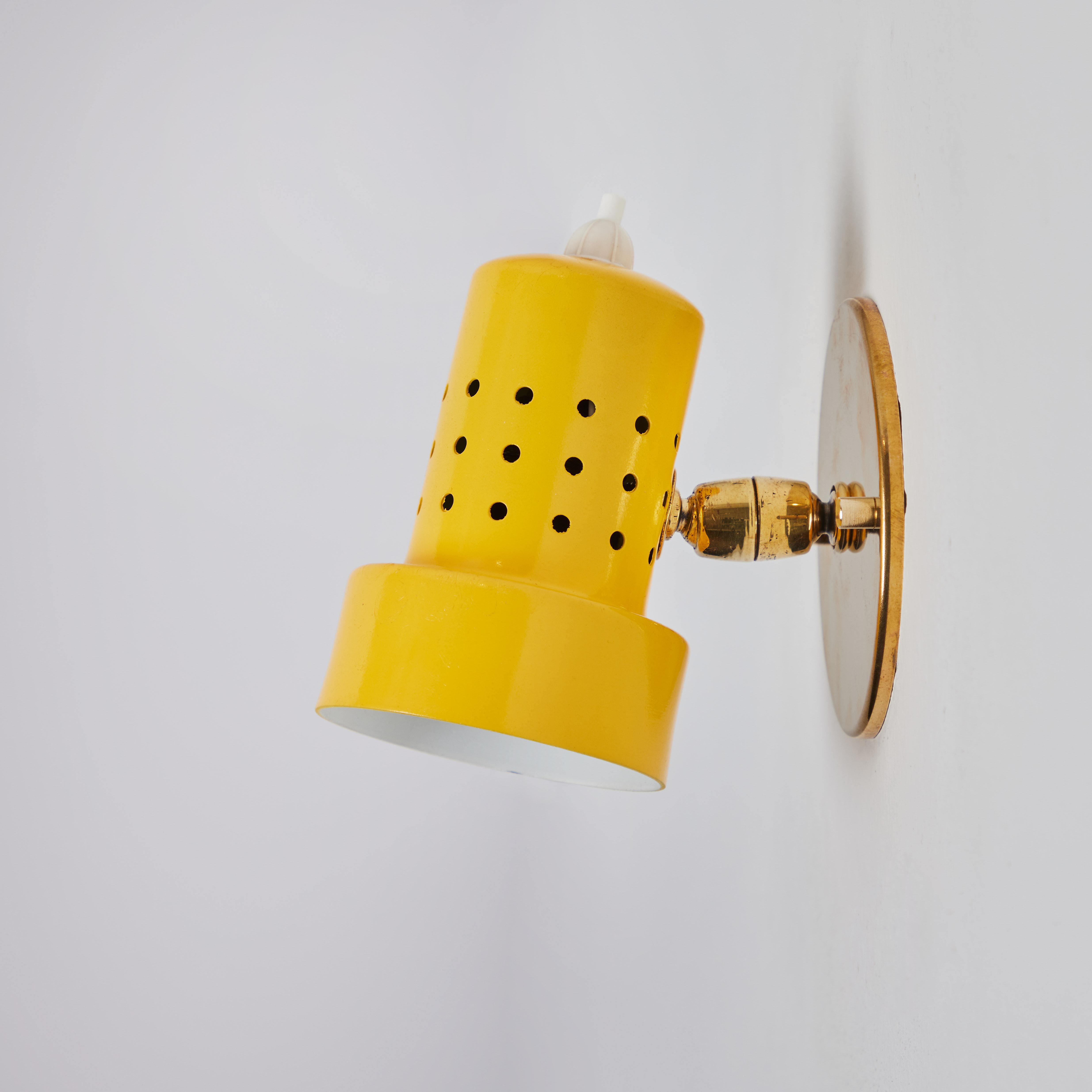 Italian Pair of 1960s Stilux Milano Perforated Yellow Articulating Sconces For Sale