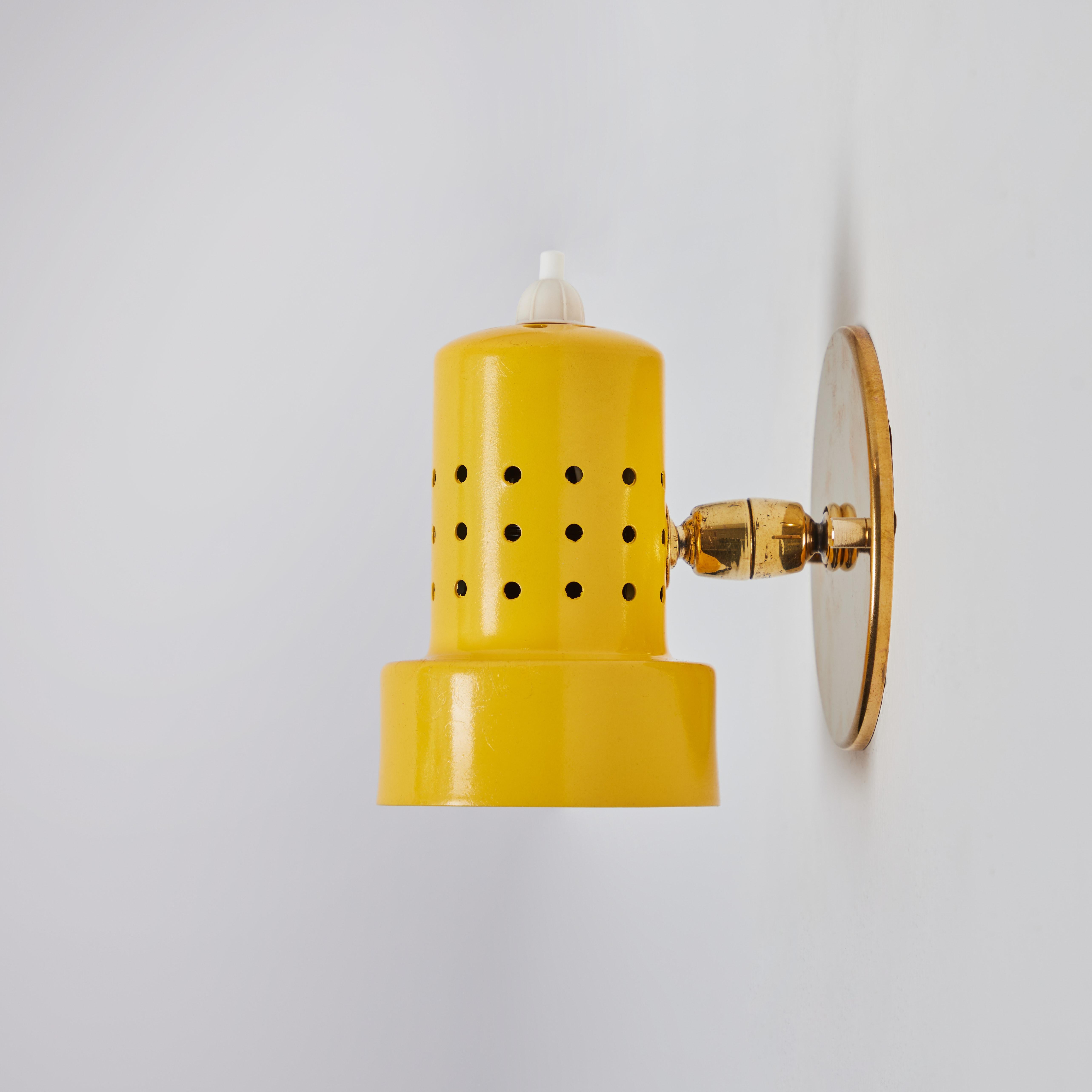 Painted Pair of 1960s Stilux Milano Perforated Yellow Articulating Sconces For Sale