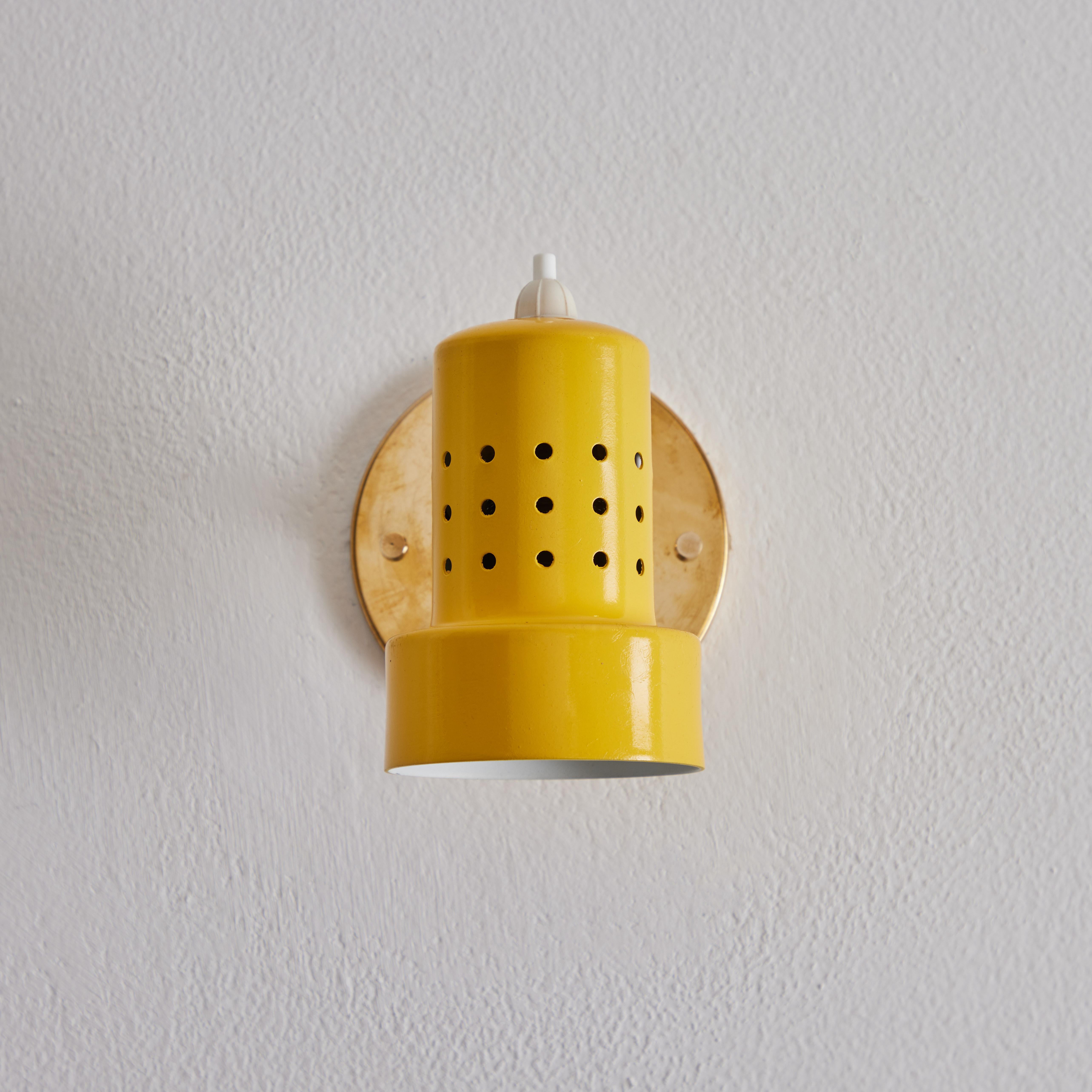 Pair of 1960s Stilux Milano Perforated Yellow Articulating Sconces In Good Condition For Sale In Glendale, CA
