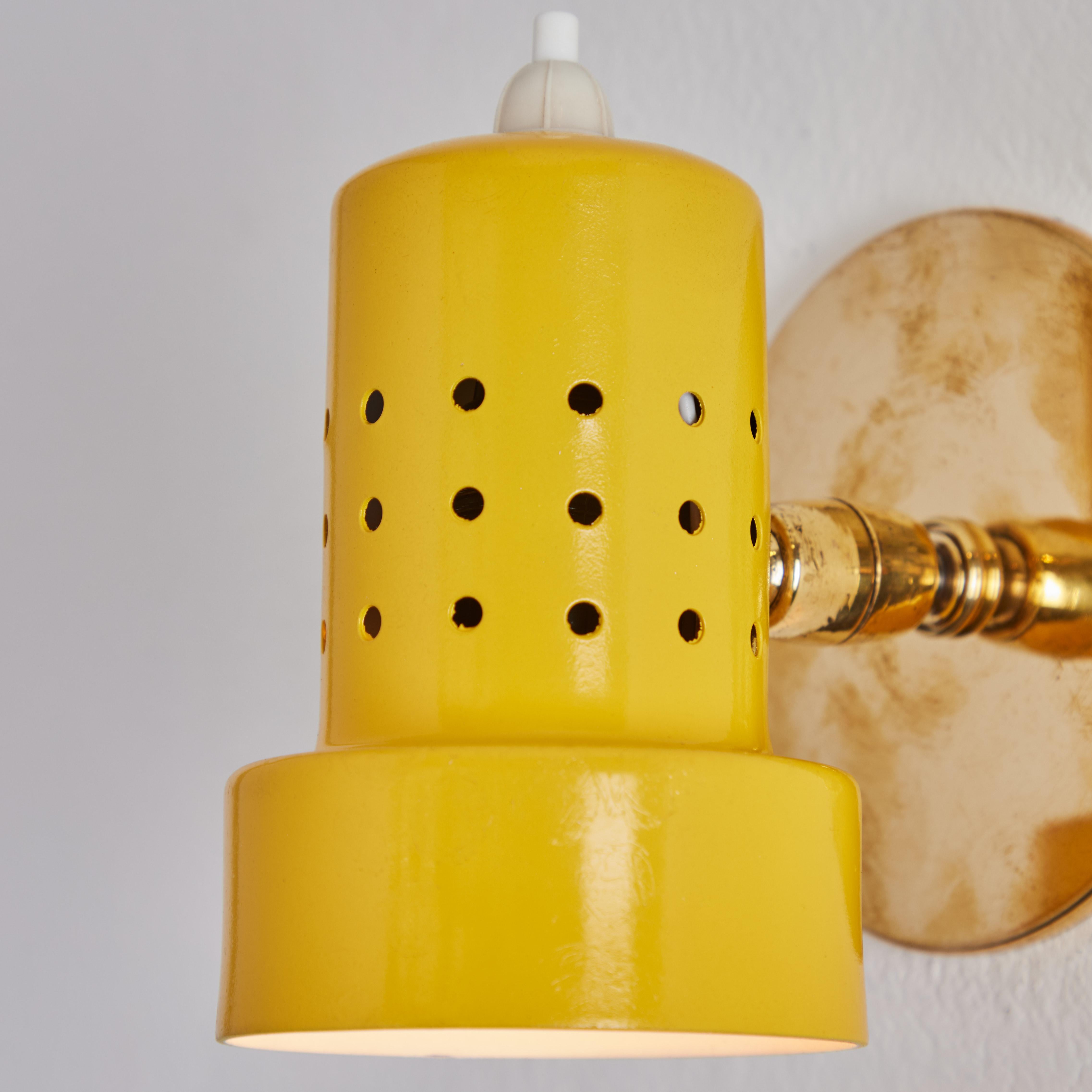 Aluminum Pair of 1960s Stilux Milano Perforated Yellow Articulating Sconces For Sale