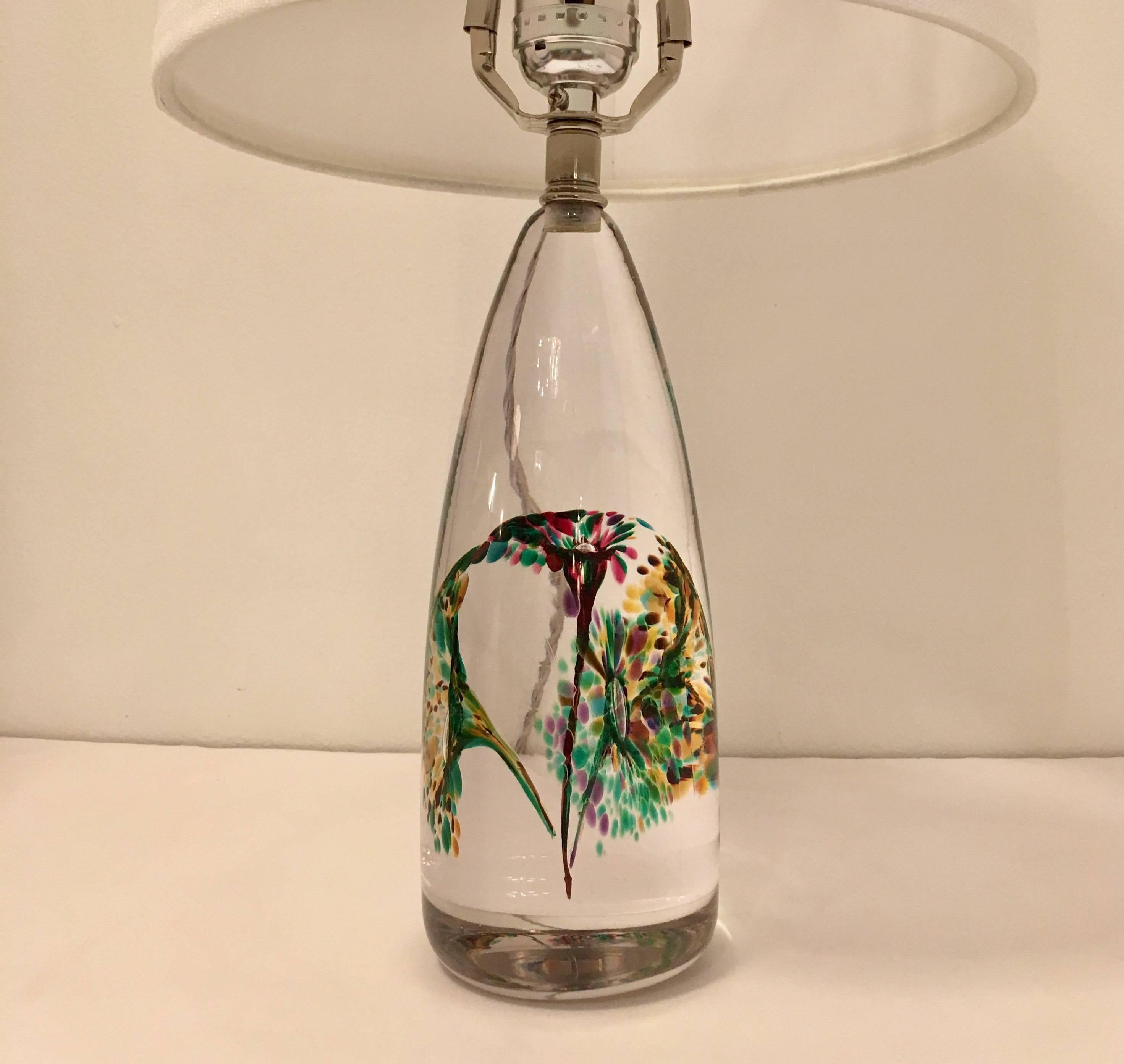 A beautiful pair of clear crystal glass with colored floral inclusions. Newly rewired. The Swedish glass crystal lamps are made by FM Konstglas, Ronneby.