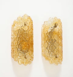 Pair of 1960's Textured Disc Glass Sconces in the style of Orrefors.