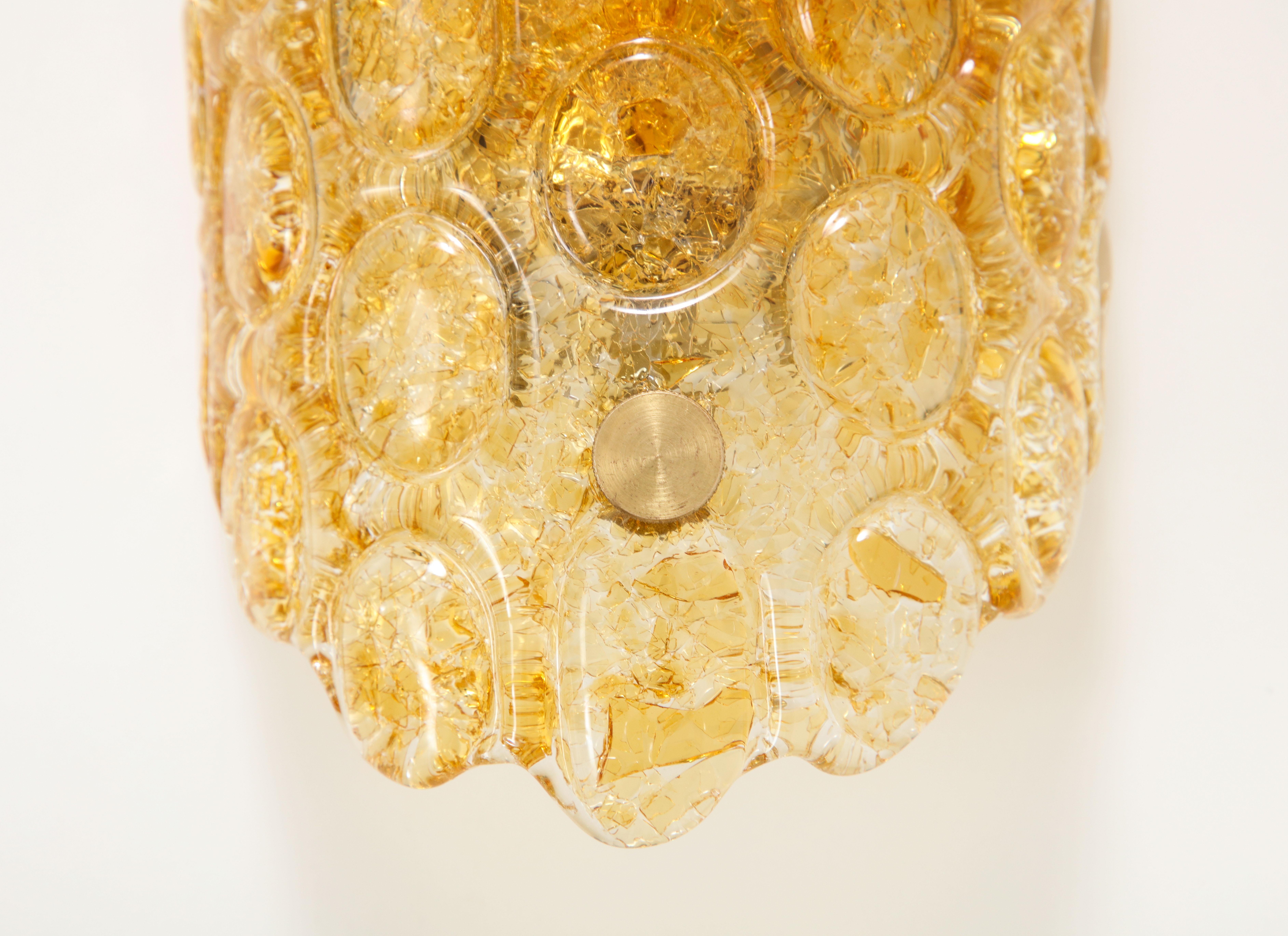 Brass Pair of 1960's Textured Disc Glass Sconces in the style of Orrefors. For Sale