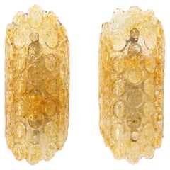 Pair of 1960's Textured Disc Glass Sconces in the style of Orrefors.