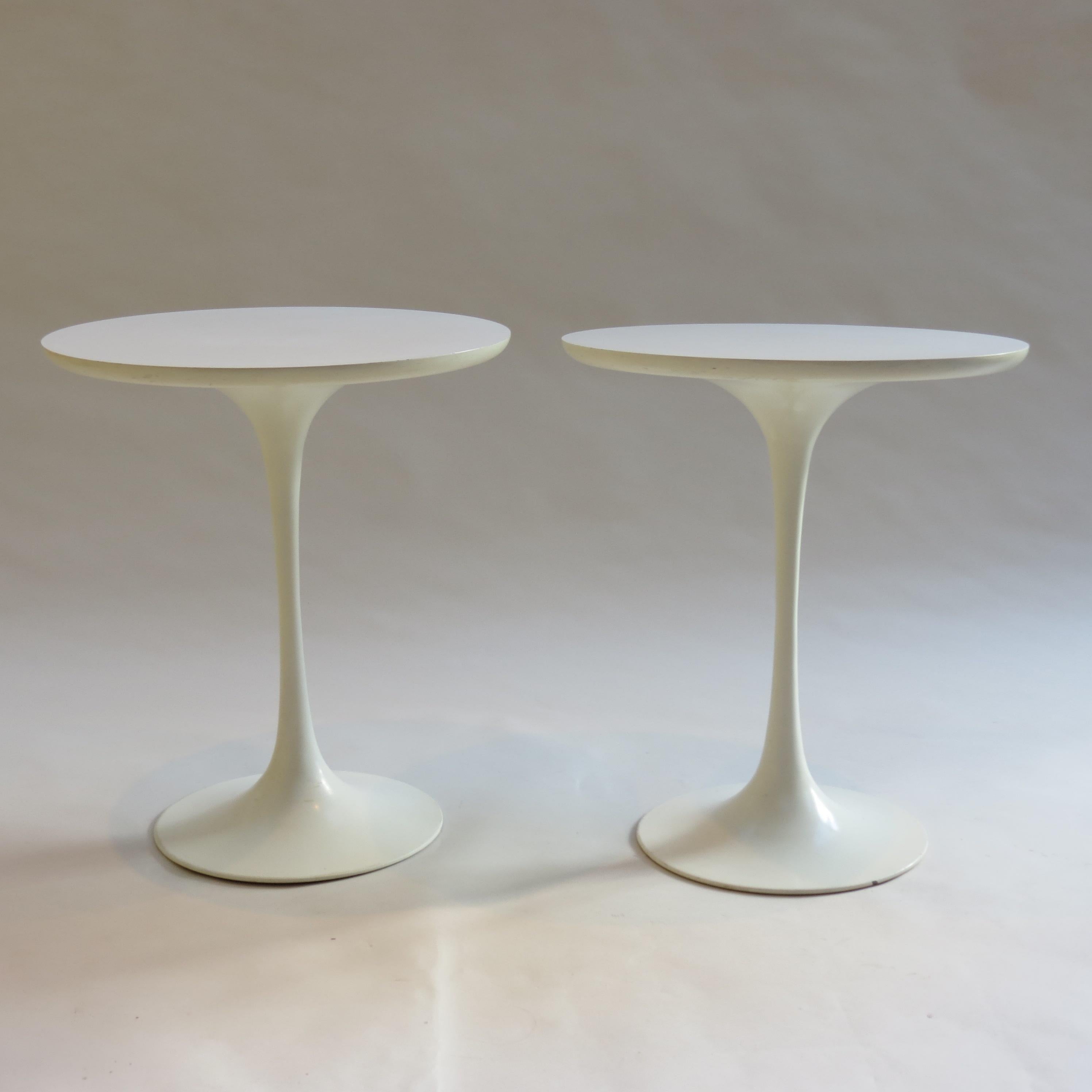 Pair of 1960s Tulip side tables designed by Maurice Burke for Arkana, Bath, UK.

Cast aluminium base and circular laminate top.

Minimal wear to the base and tops.

Stamped to underside of base Arkana No 12

Total of 6 identical tables