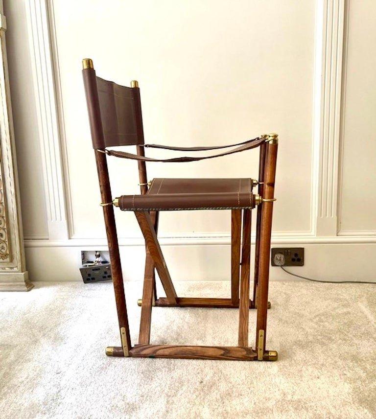 A fine pair of Almazan folding campaign chairs dating from the 1960s after the Mogens Koch Mk-16 Safari chair which were originally designed in 1932.
Beautifully detailed with hand-stitched brown saddle leather for the back, arms and seat, finished