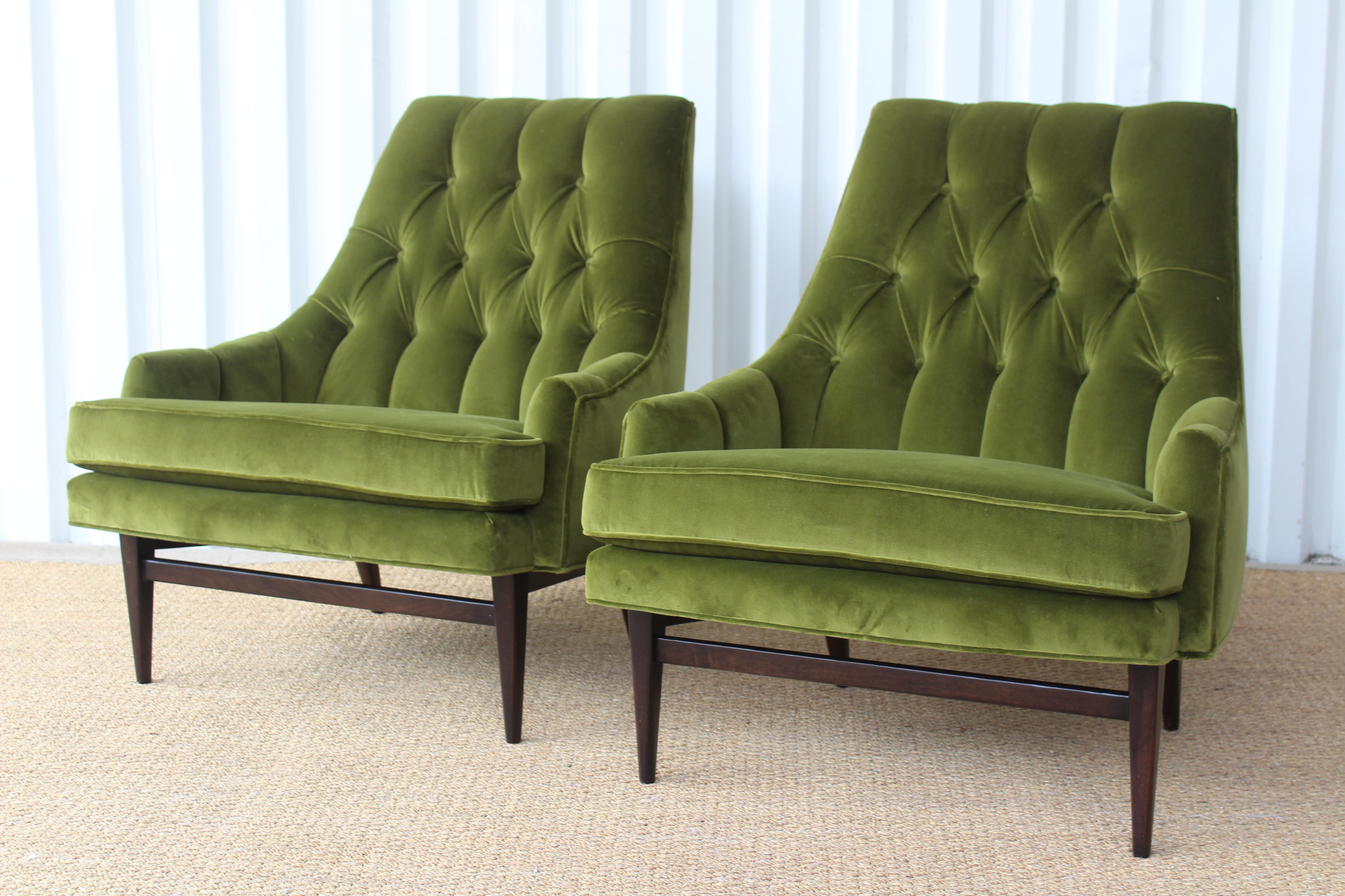 Pair of vintage 1960s tufted lounge chairs. Newly upholstered in an avocado green Italian velvet. The wood legs have been refinished in a dark walnut color. This velvet used is delicate and prone to crushing, due to the nature of the fabric you will