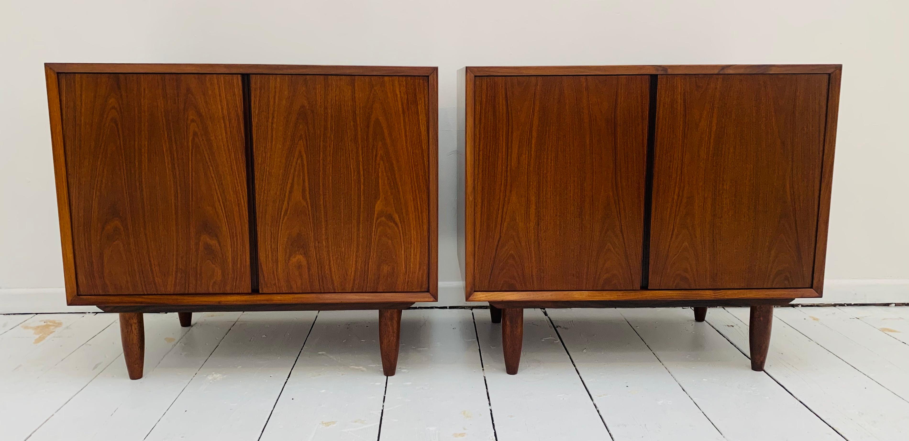 A wonderful pair of 1960s Danish Rosewood cabinets, small sideboards or cupboards designed by Poul Cadovius for Cado.

The cabinets have been fully restored to enhance the beautiful veneered rosewood grain with matching interiors. A single shelf