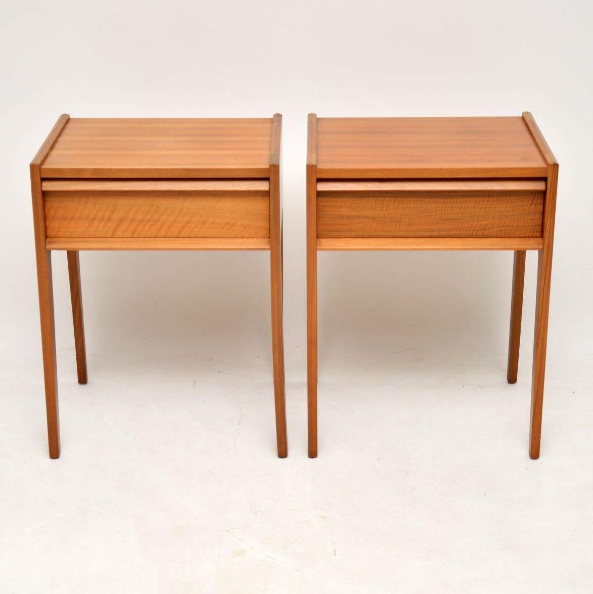 A stylish, rare and extremely well made pair of vintage bedside tables in walnut, these were made by Younger, they date from the 1960s. They are in great original condition, with only some very minor wear and one or two very light marks. They have a