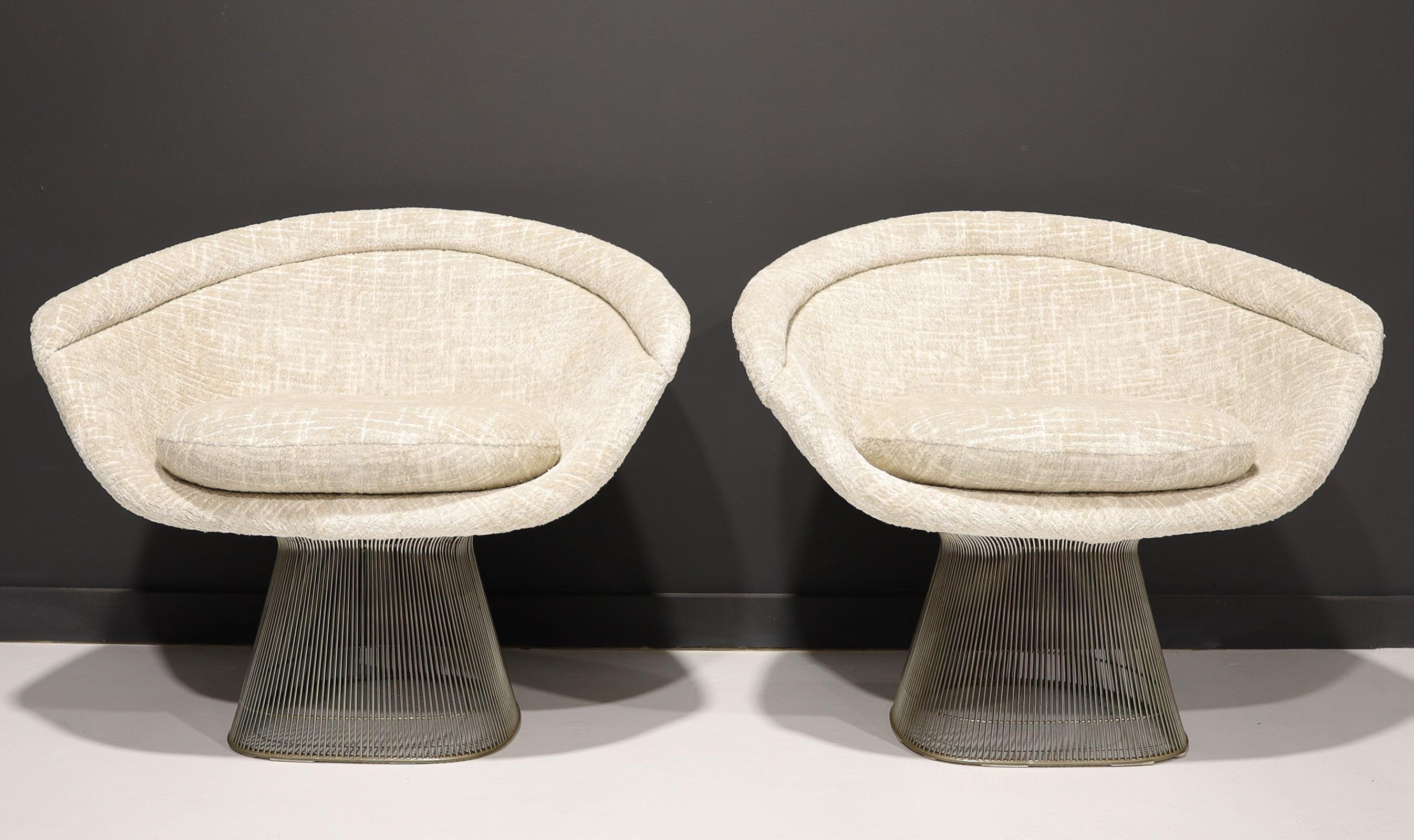 We have a beautiful set of 1960s lounge chairs. Platners first made their debut in 1966. Steel-rod construction with nickel-plate. We have reupholstered in a plush heavily textured and soft French fabric by Metaphores.